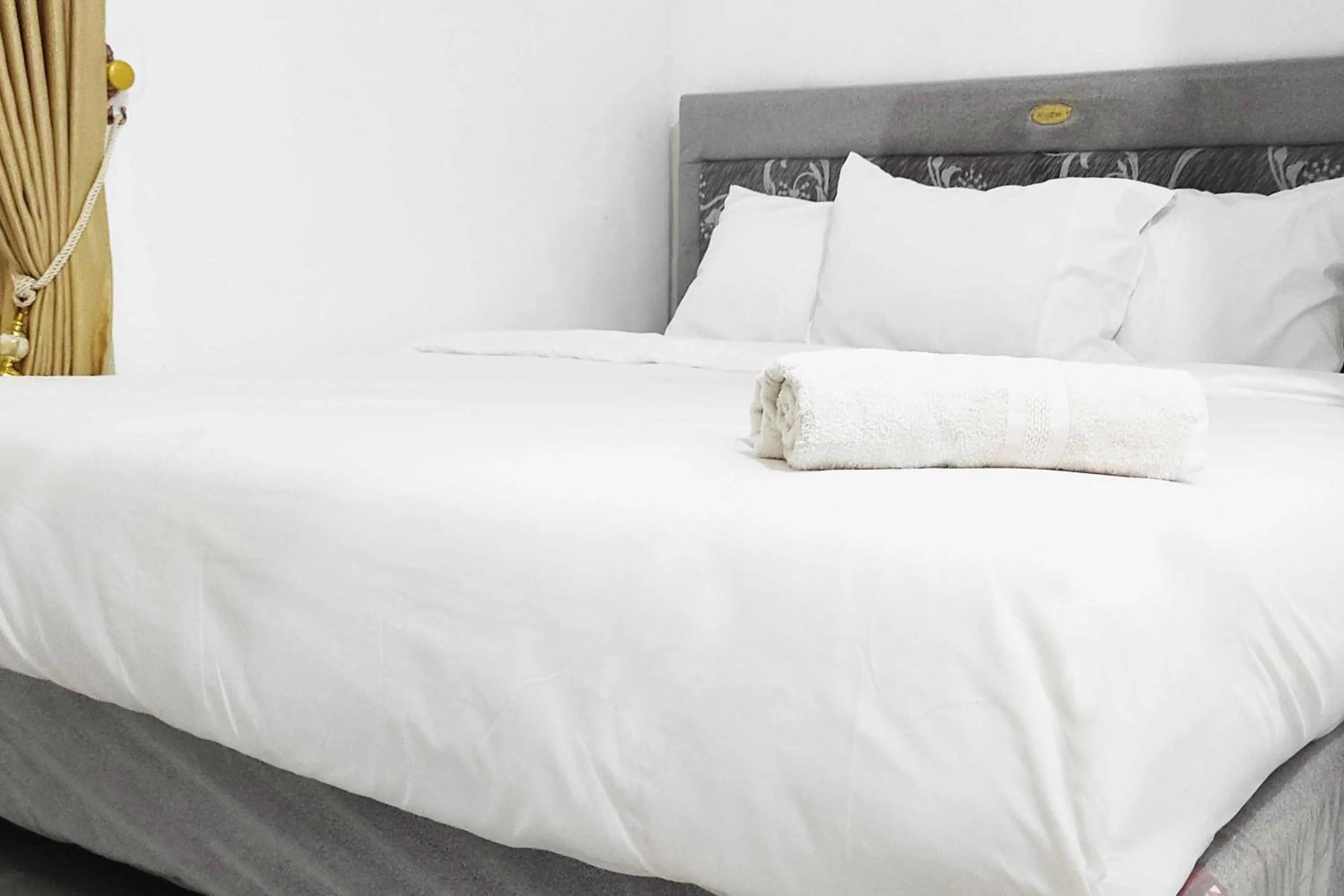 Bed in Pertiwi Homestay Near Museum Angkut Batu Mitra RedDoorz