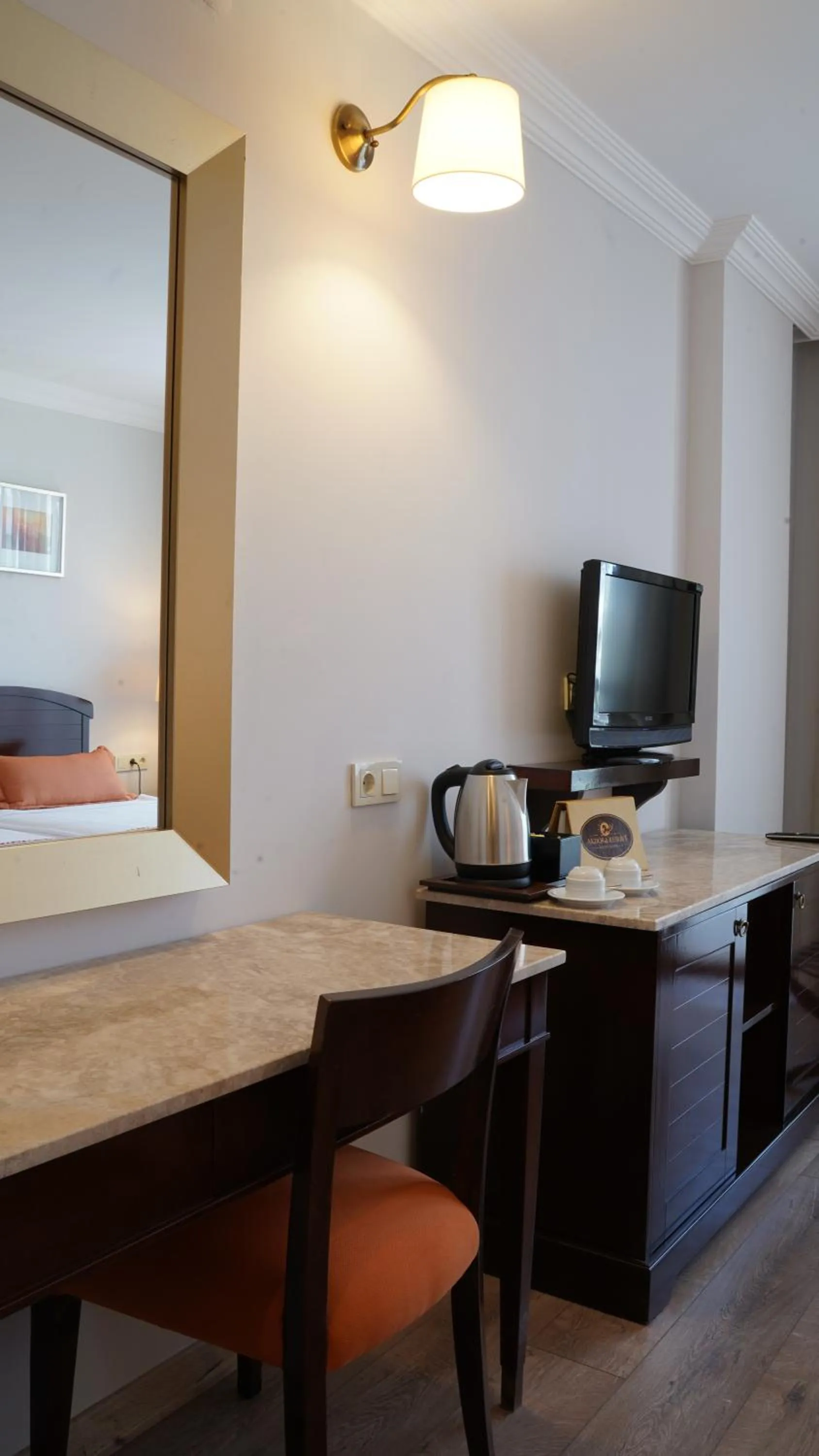 Bed, TV/Entertainment Center in Akdora Resort Hotel & Spa