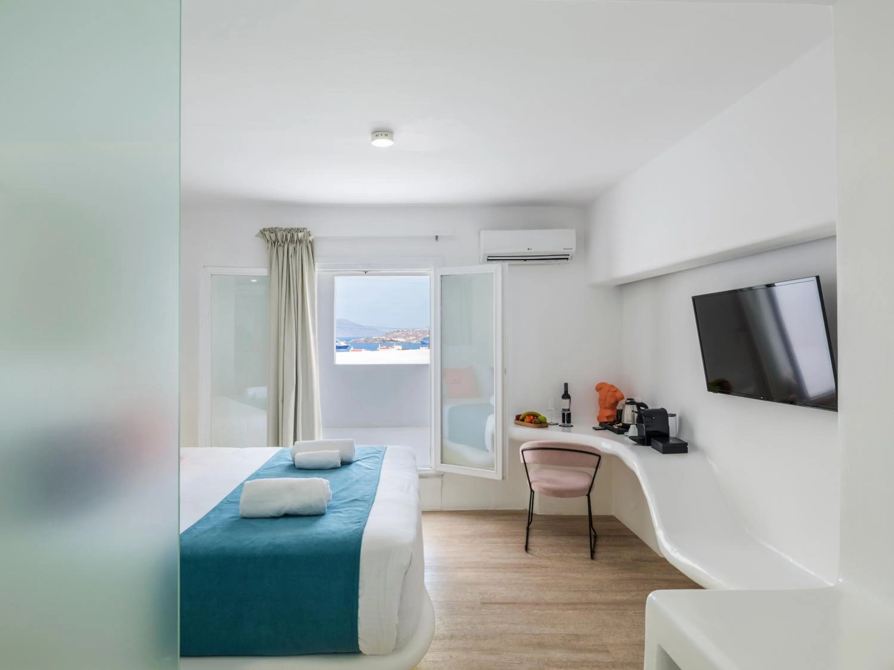 Communal lounge/ TV room, Bed in Akkadian LGBT Boutique Hotel