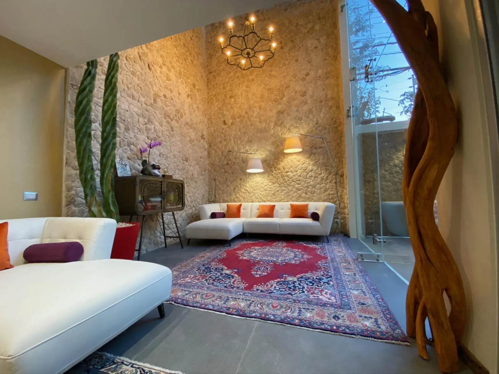 Communal lounge/ TV room in Casarte Boutique Hotel