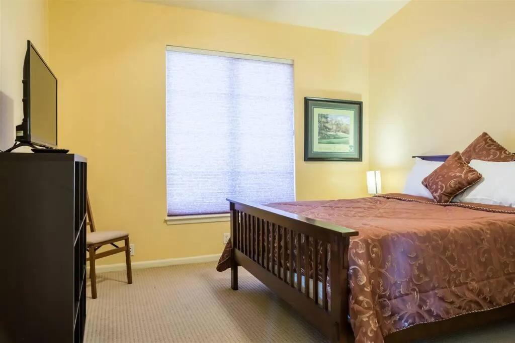 Bed in Spacious golf course house with pool heater, spa