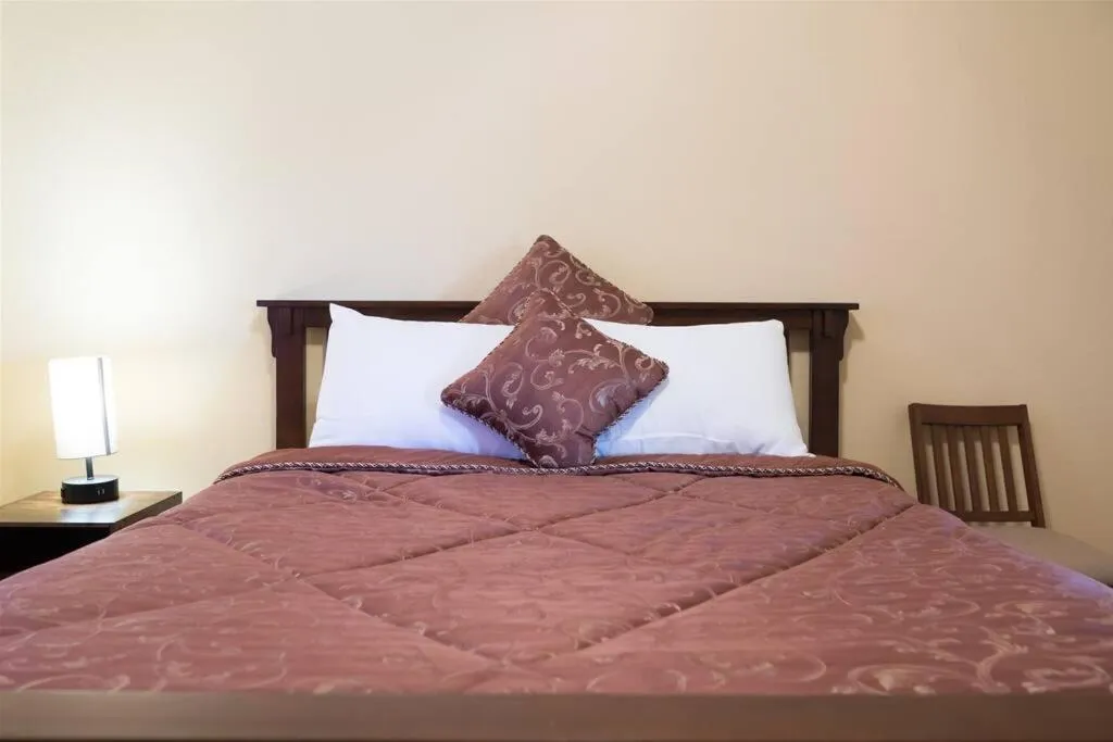 Bed in Spacious golf course house with pool heater, spa