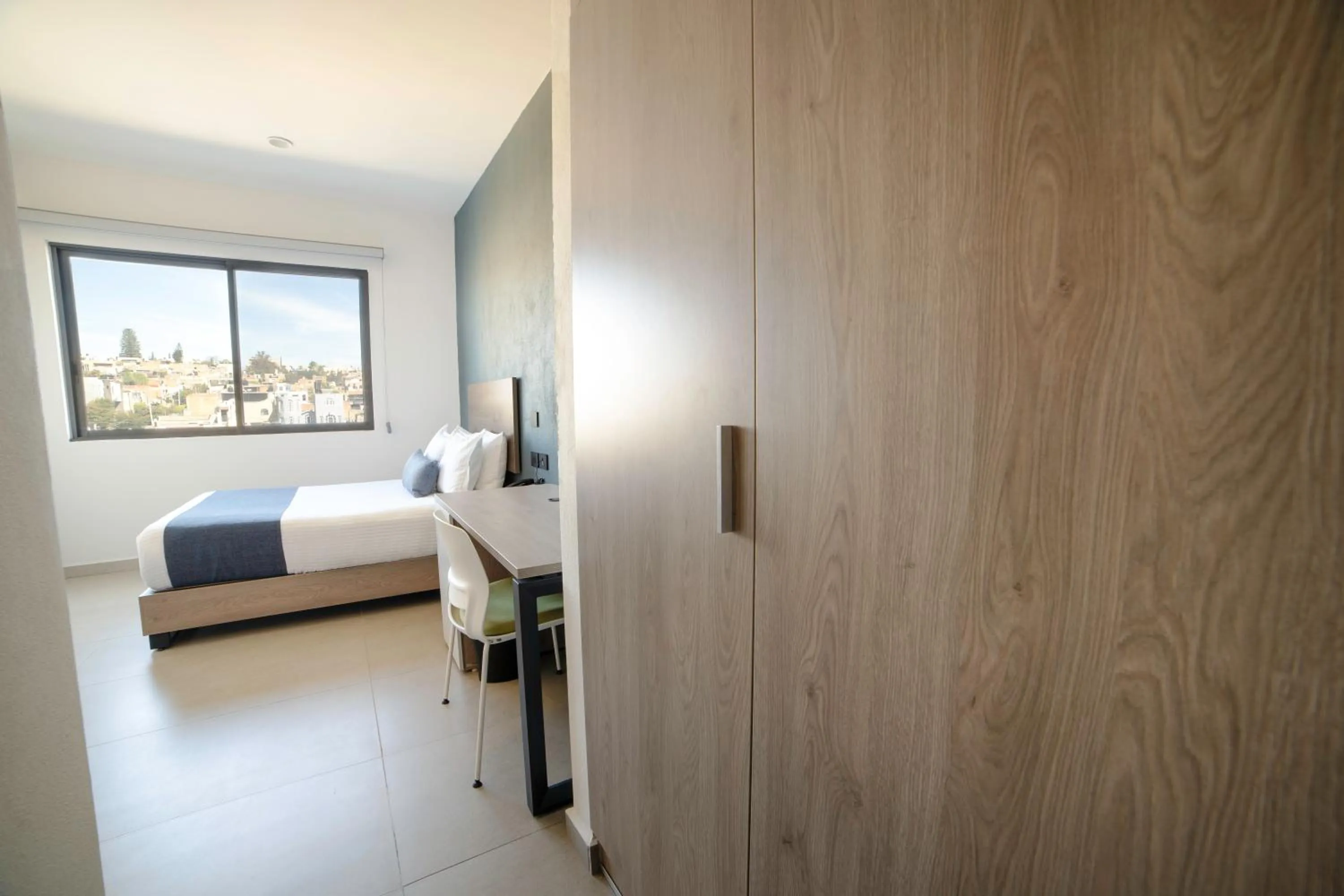 Seating area, Bed in TH HOTEL & VIVIENDA