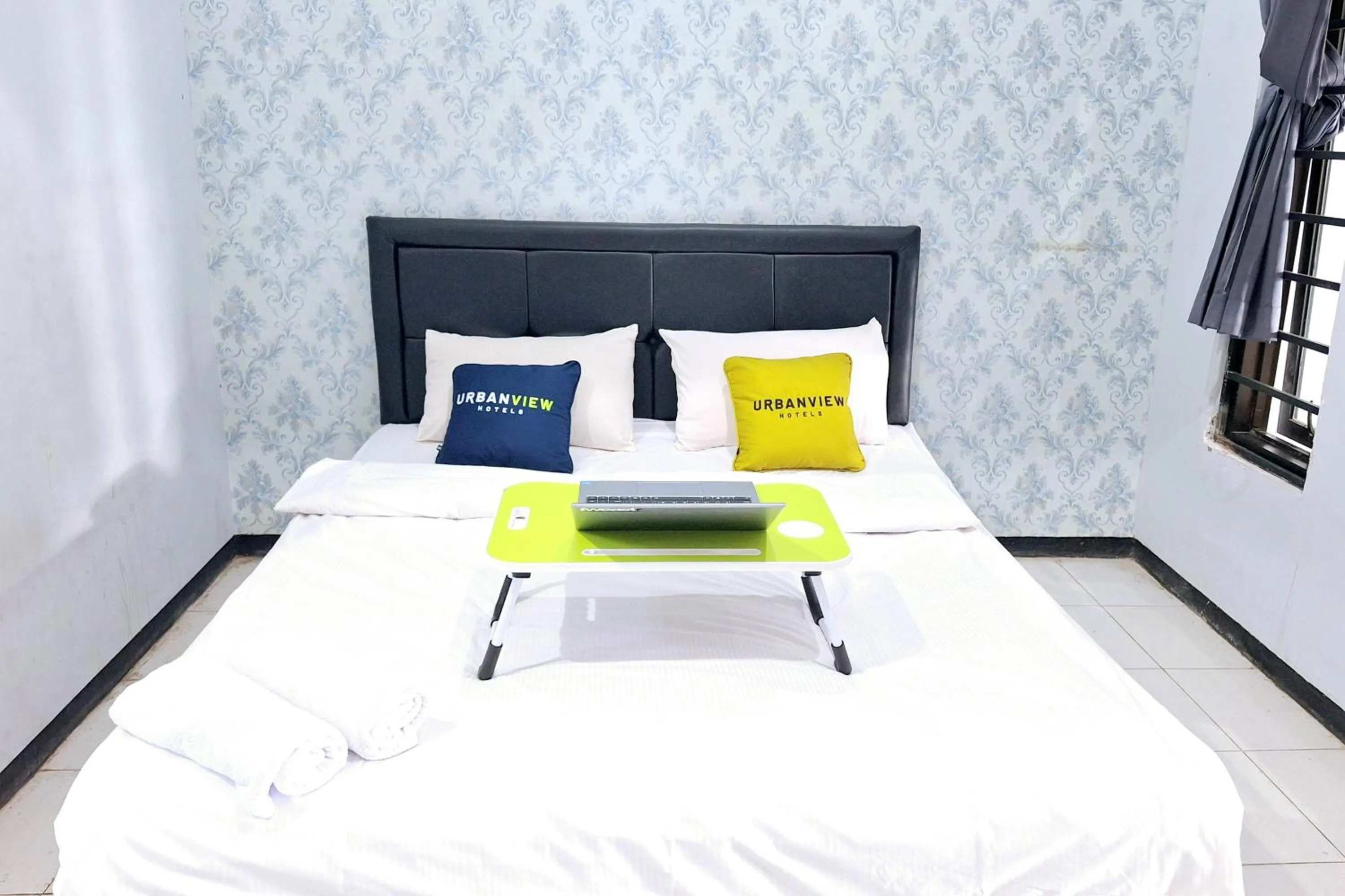 Bedroom, Bed in Urbanview The Halona near Jawa Timur Park 4