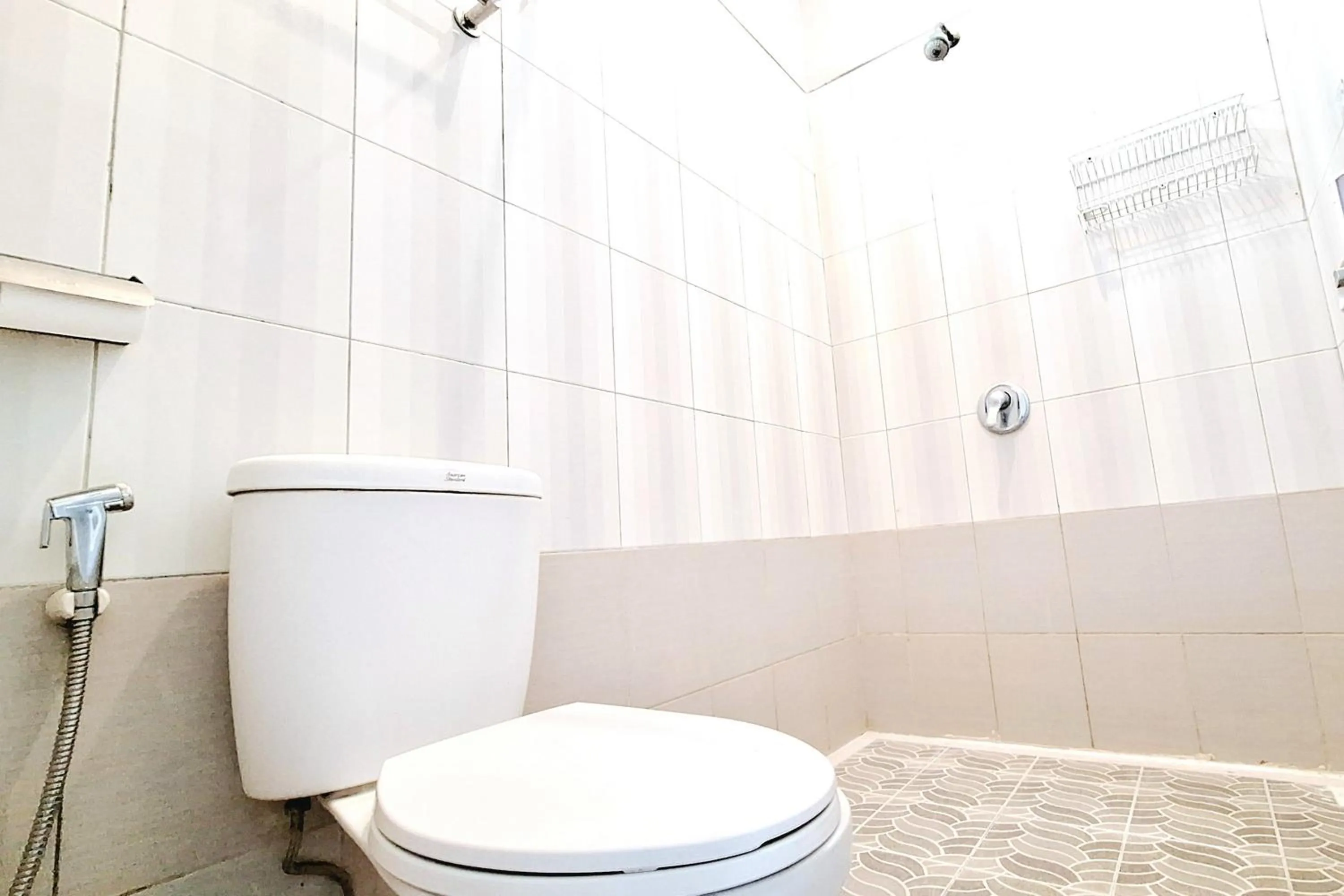 Bathroom in Urbanview The Halona near Jawa Timur Park 4