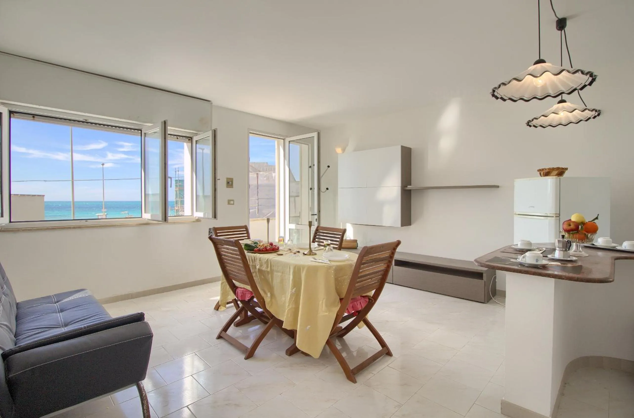 Living room in Front Beach Torre Mozza by LoveSud