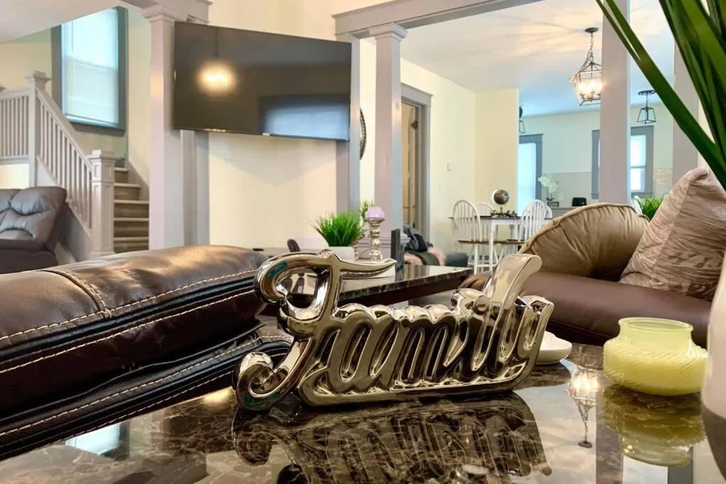 Living room in The Hennepin House- With Private Yard & Parking, Minutes From Falls & Casino by Niagara Hospitality