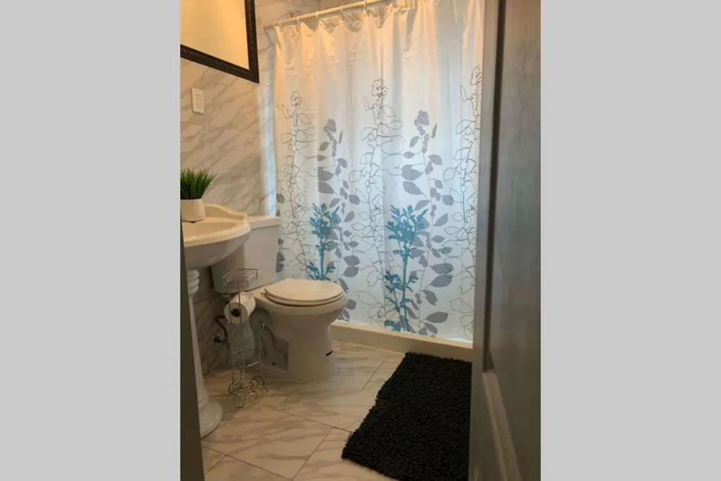 Bathroom in The Hennepin House- With Private Yard & Parking, Minutes From Falls & Casino by Niagara Hospitality
