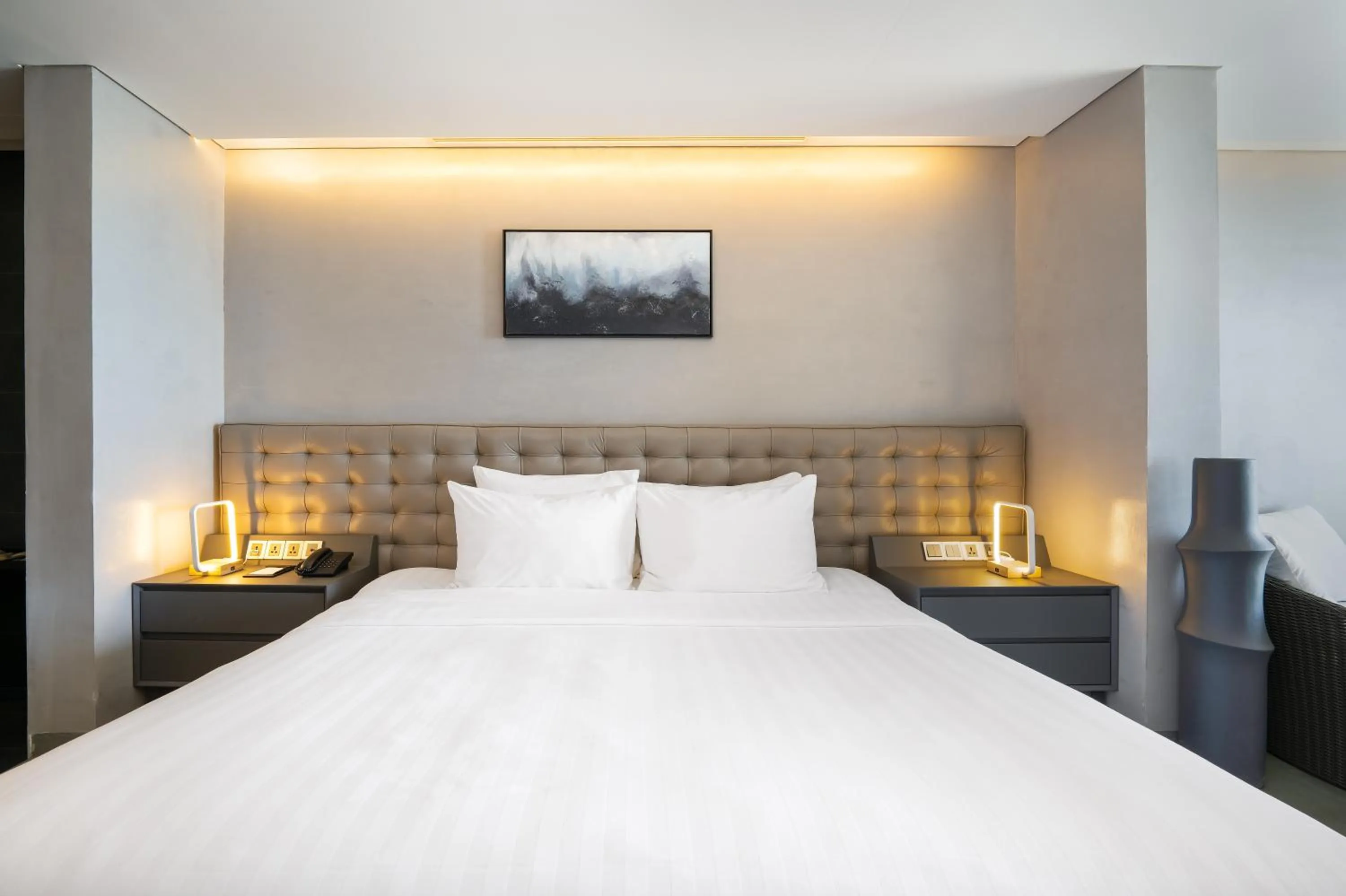 Bed in M SUITE Danang Beach