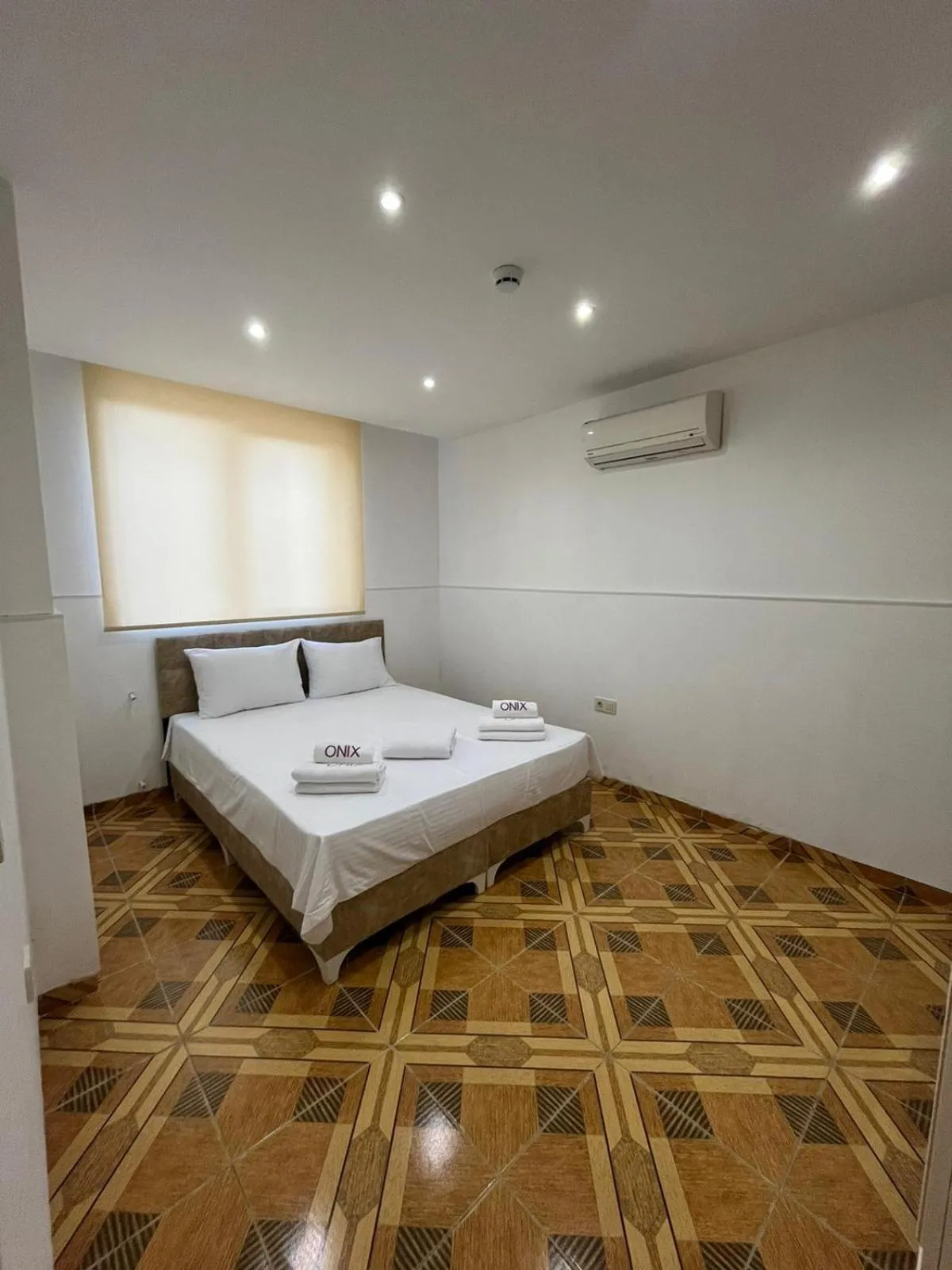 Bed in Onix Apart Hotel