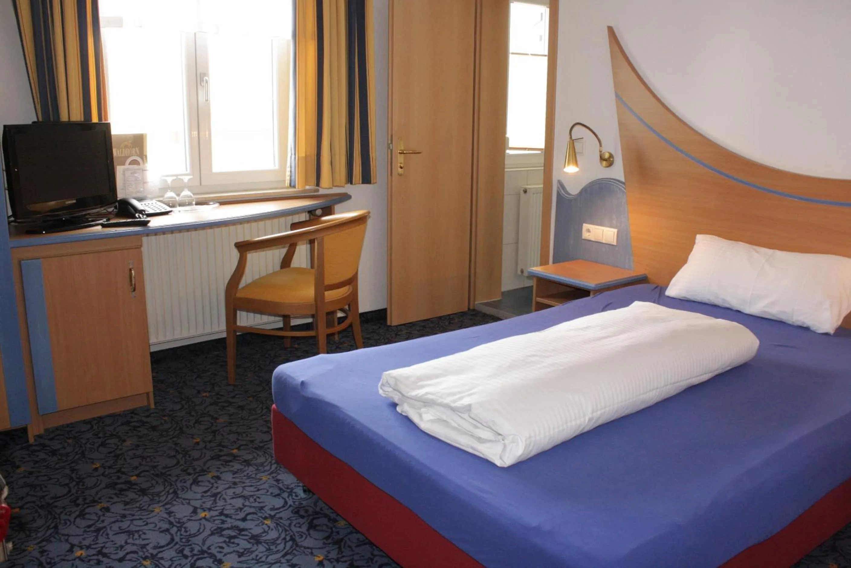 Photo of the whole room, Bed in Hotel Waldhorn