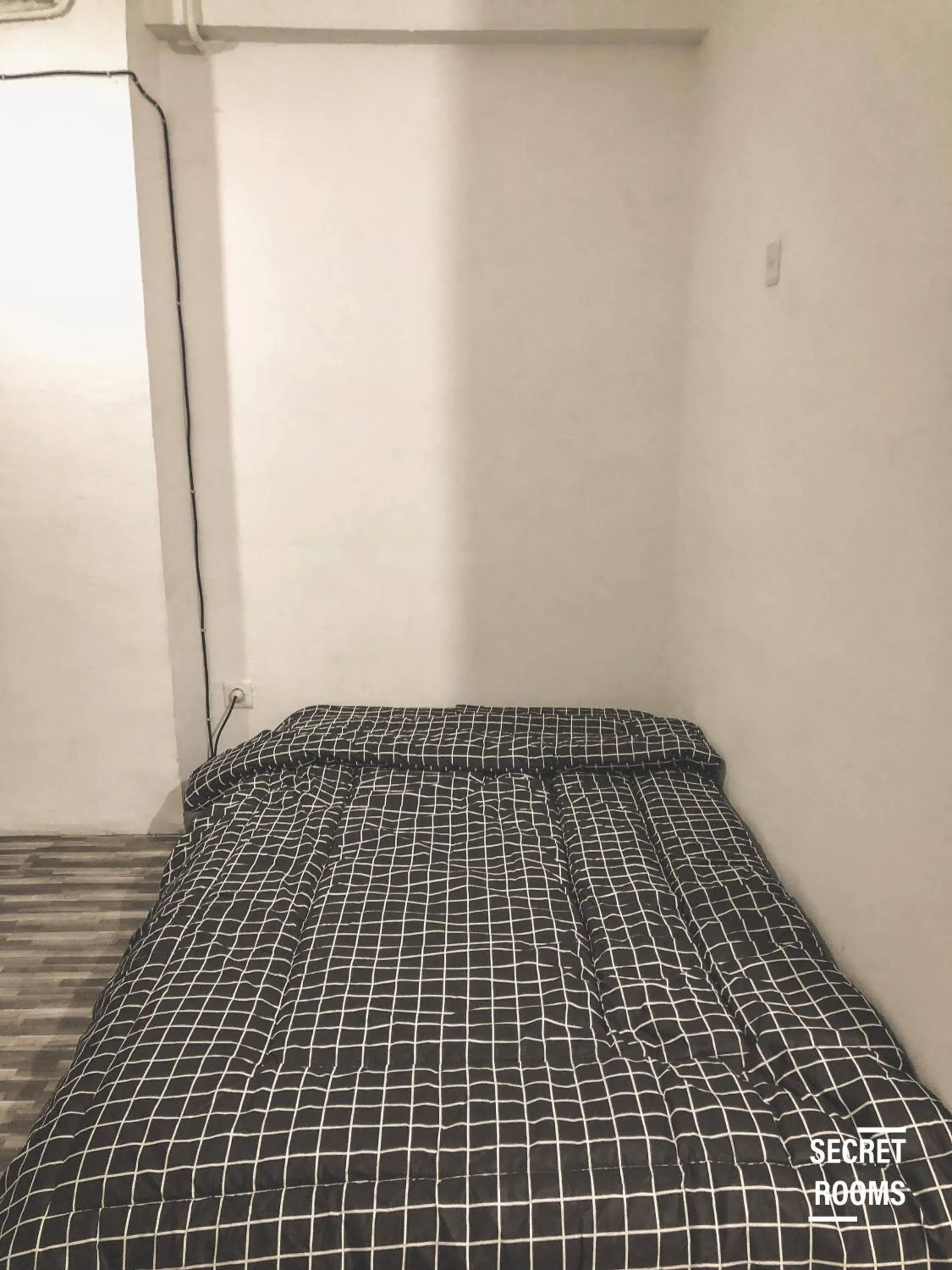 Bed in The Jarrdin Apartement by Secret Rooms