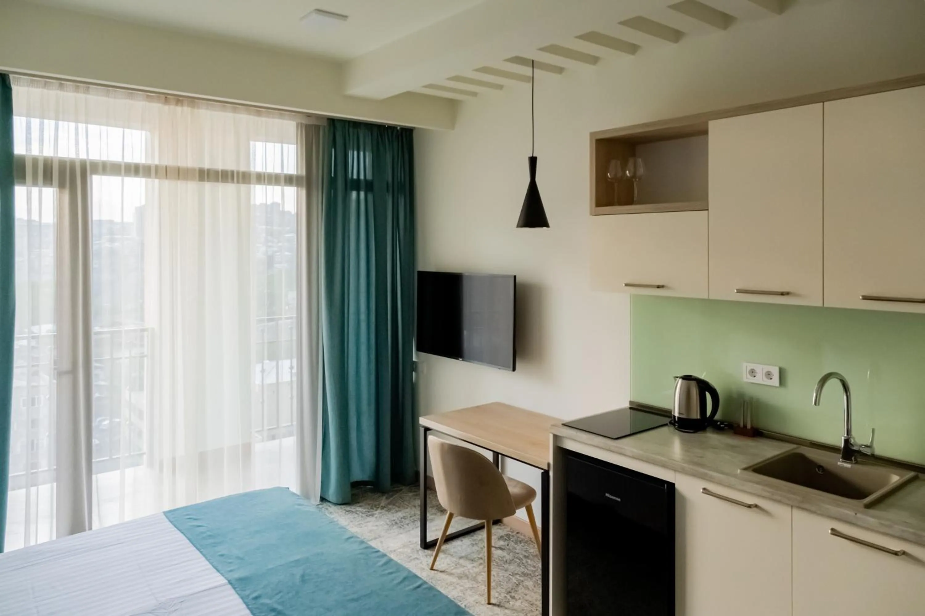 Kitchen or kitchenette in Rooftop Apart-Hotel