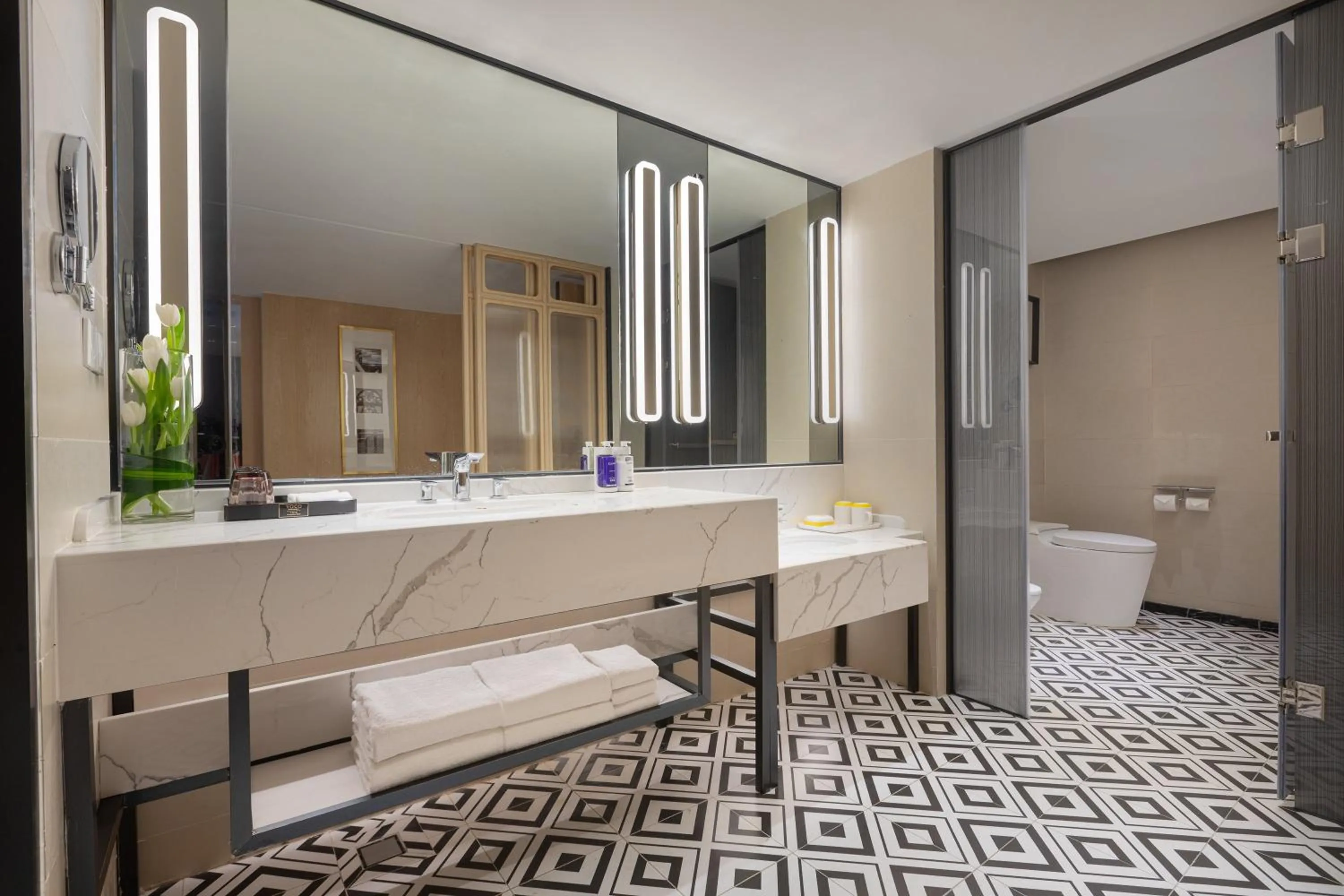 Bathroom in voco Guangzhou Shifu by IHG