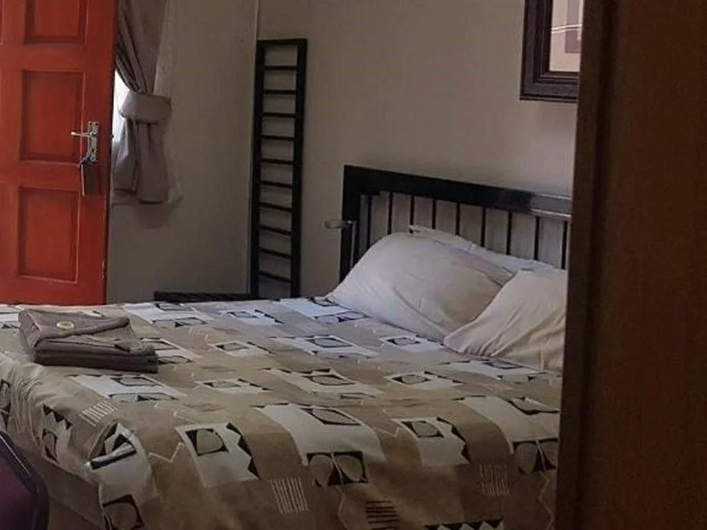 Bed in Country Blue Luxury Guest House