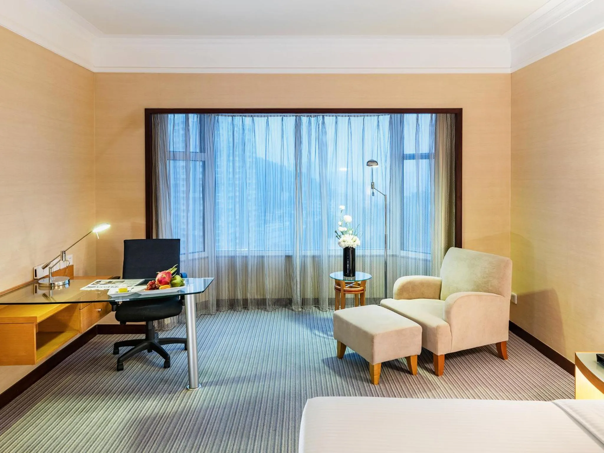 Seating area, Bed in Millennium Harbourview Hotel Xiamen