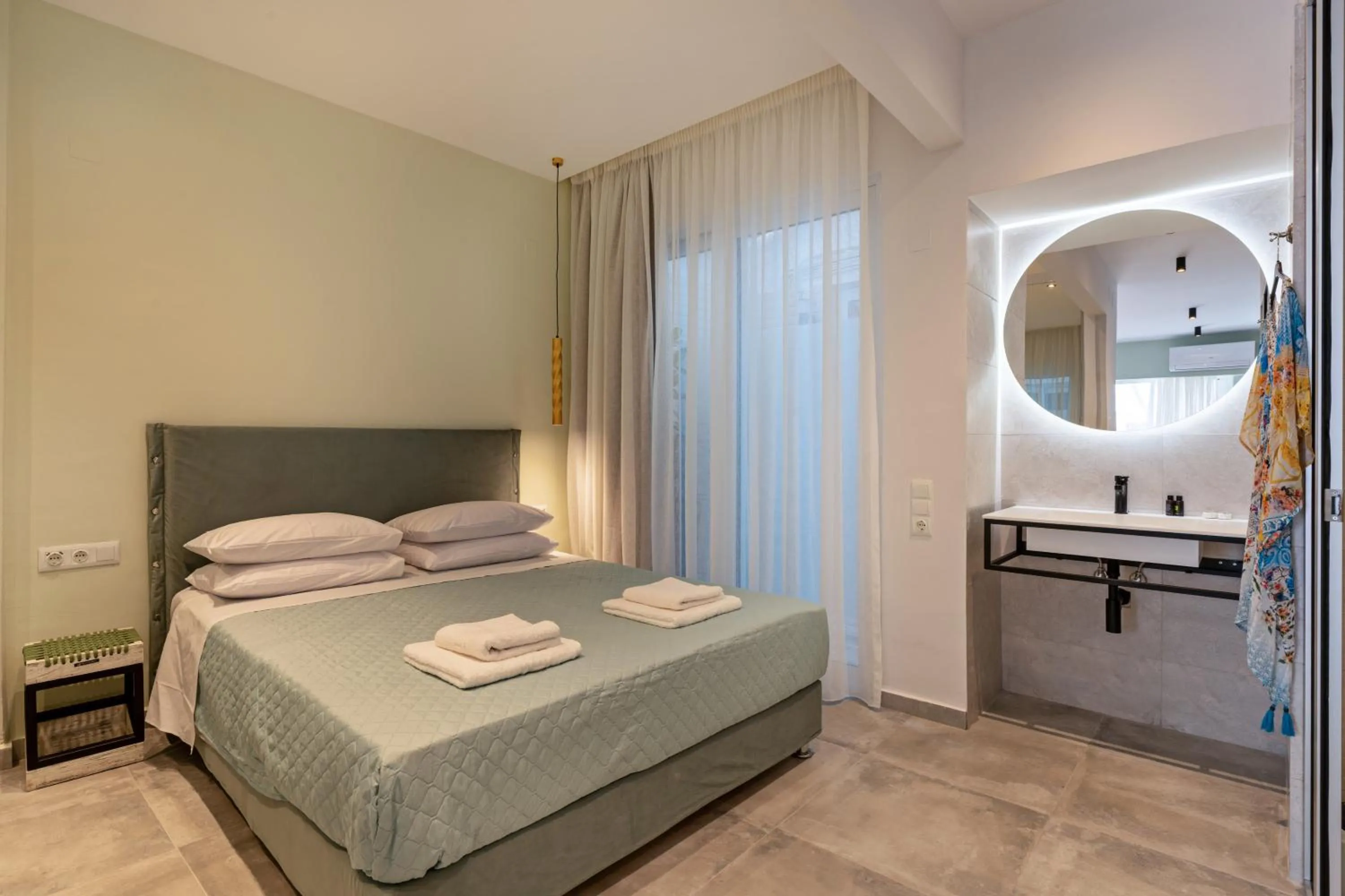 Bed in City and Sand Suites