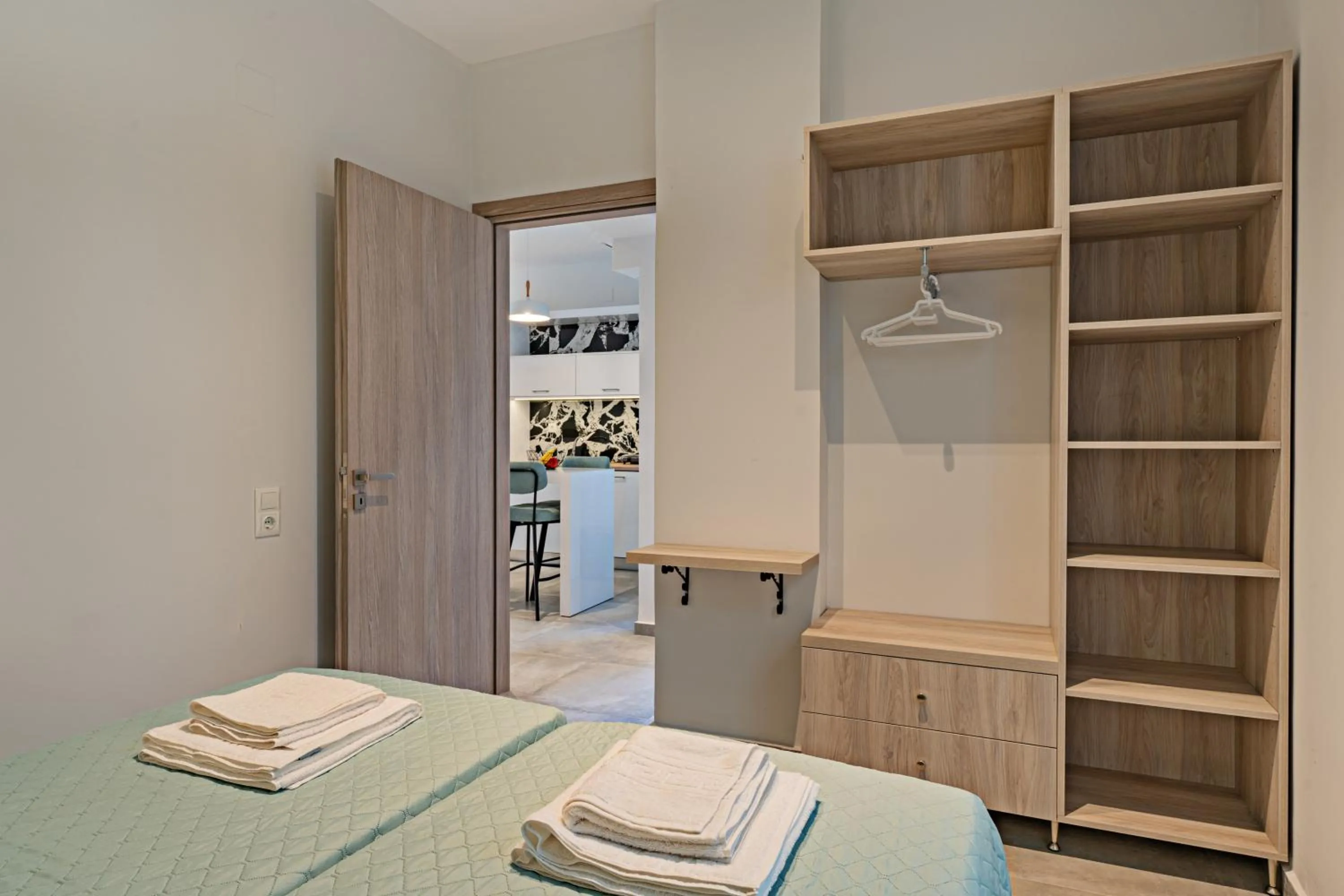 Bed in City and Sand Suites