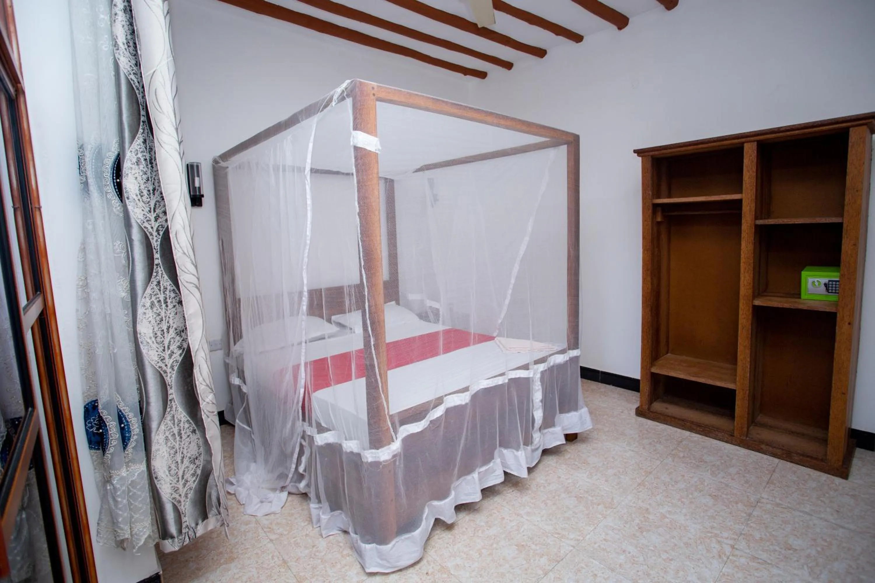 Bed in Utulivu Bungalow