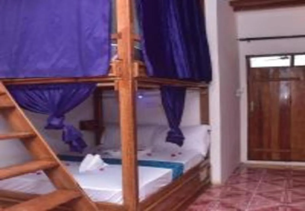 Bed in Utulivu Bungalow