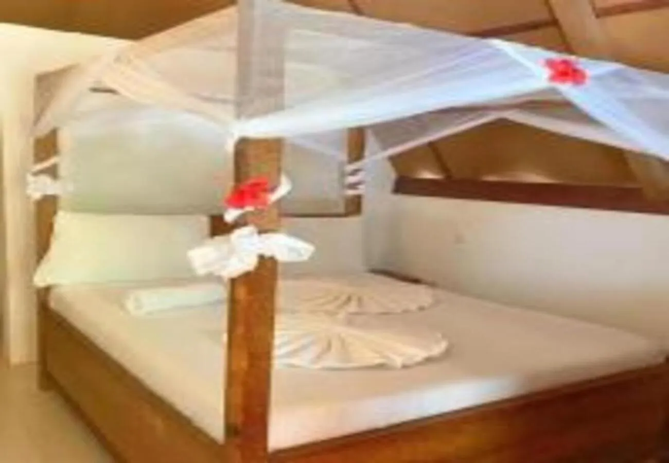 Bed in Utulivu Bungalow