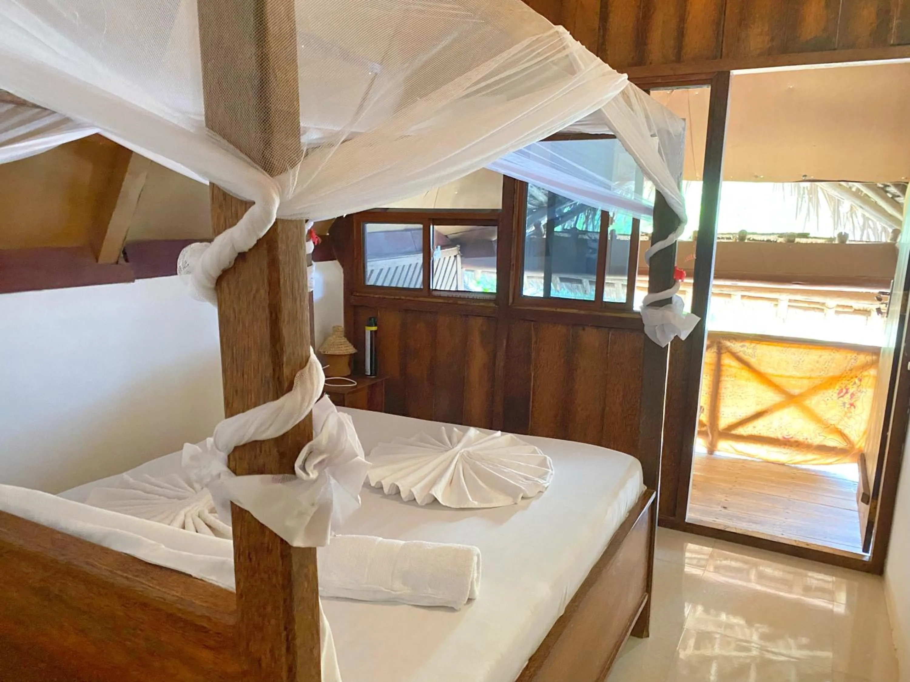 Bed in Utulivu Bungalow