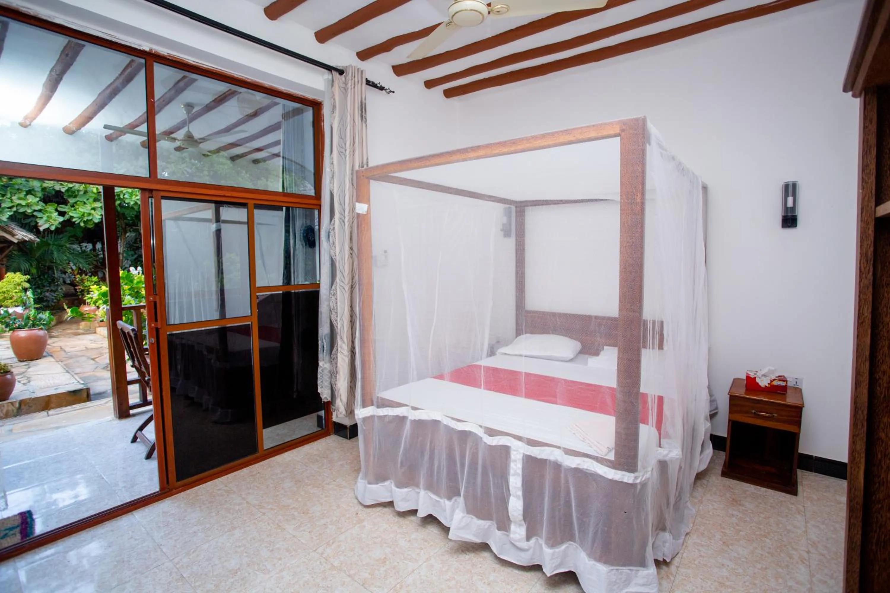 Bed in Utulivu Bungalow