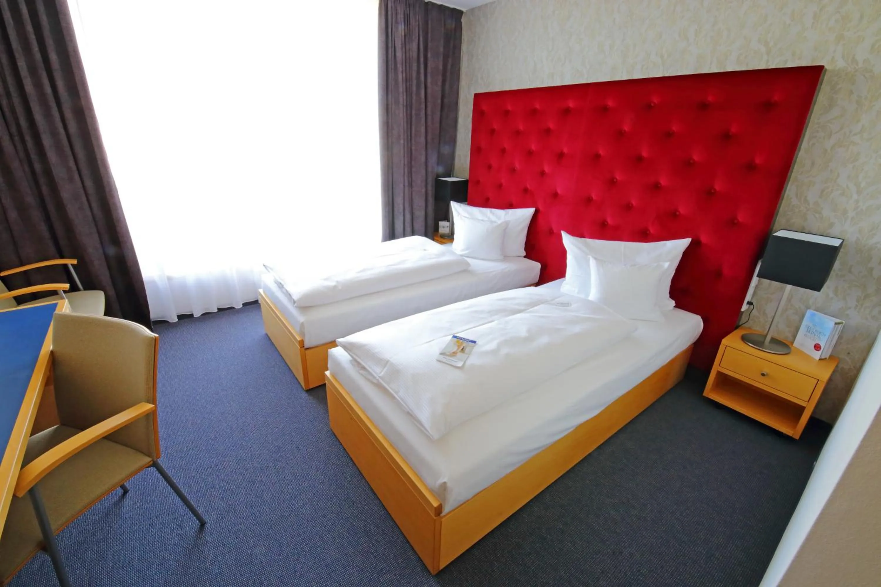 Bed in rugs Hotel am Schlosspark Lichtenwalde