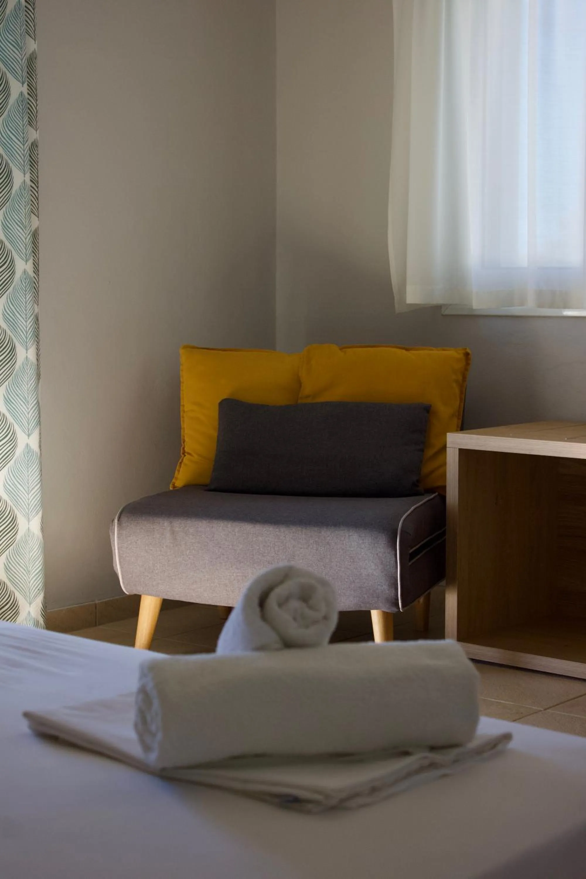 Seating area, Bed in Chloe Apartments