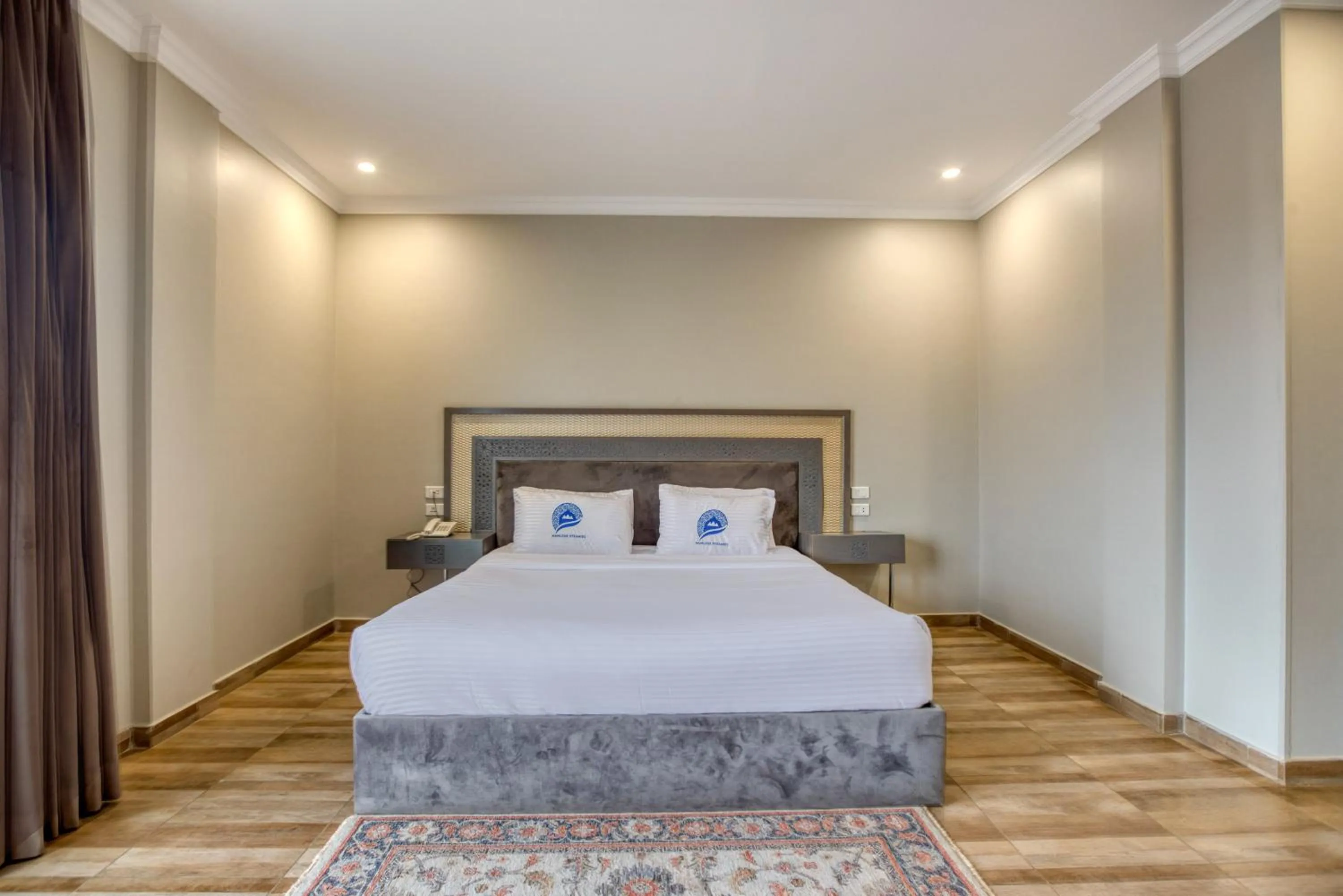 Bed in Mamlouk Pyramids Hotel