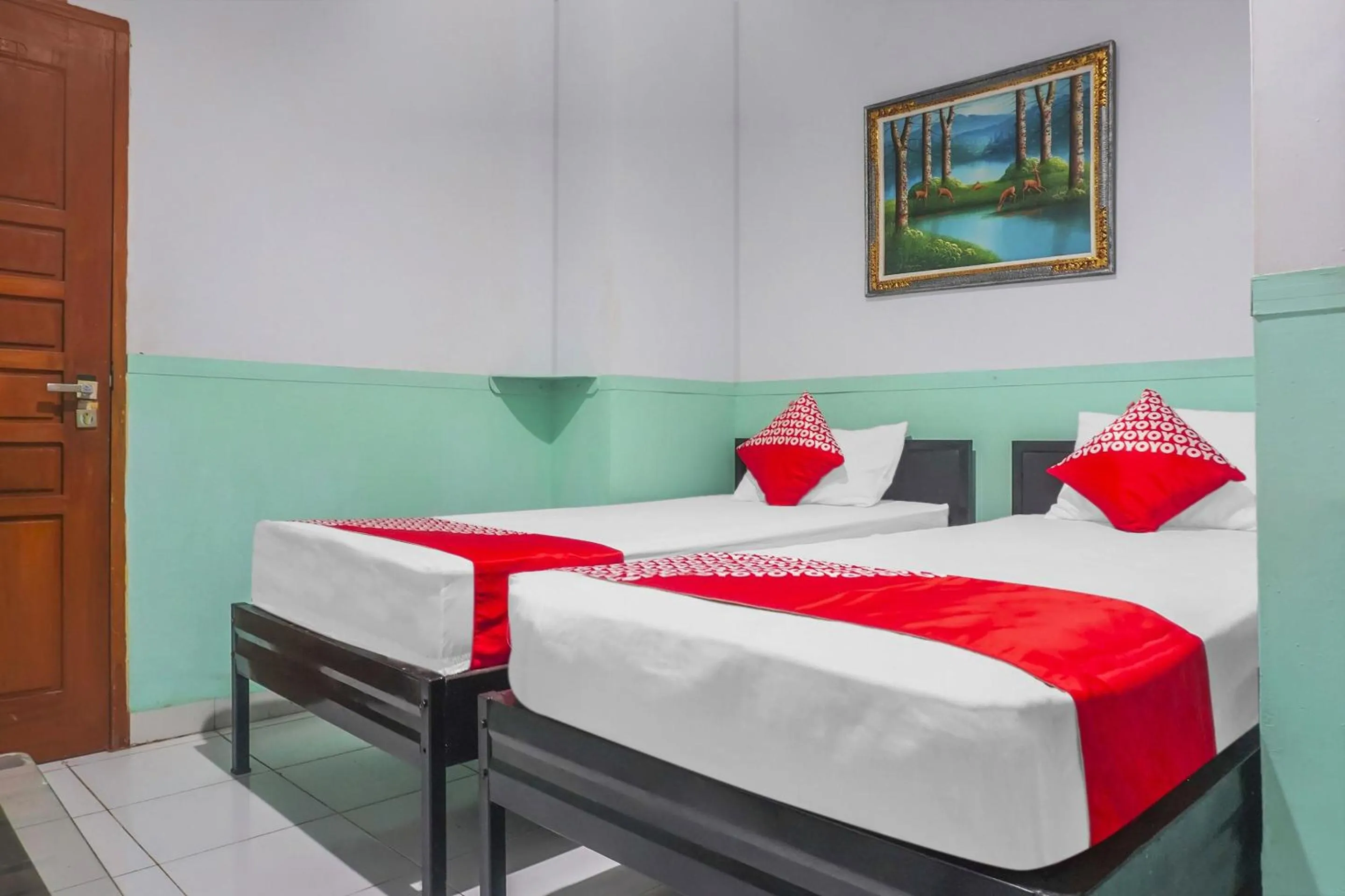 Bedroom in Hotel O Wisma Favorite Makassar Near Benteng Rotterdam