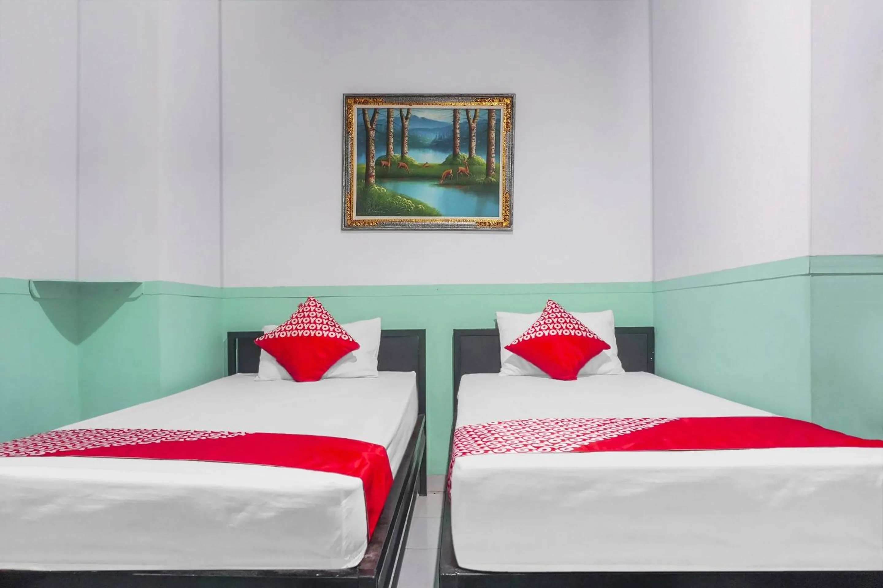 Bedroom in Hotel O Wisma Favorite Makassar Near Benteng Rotterdam