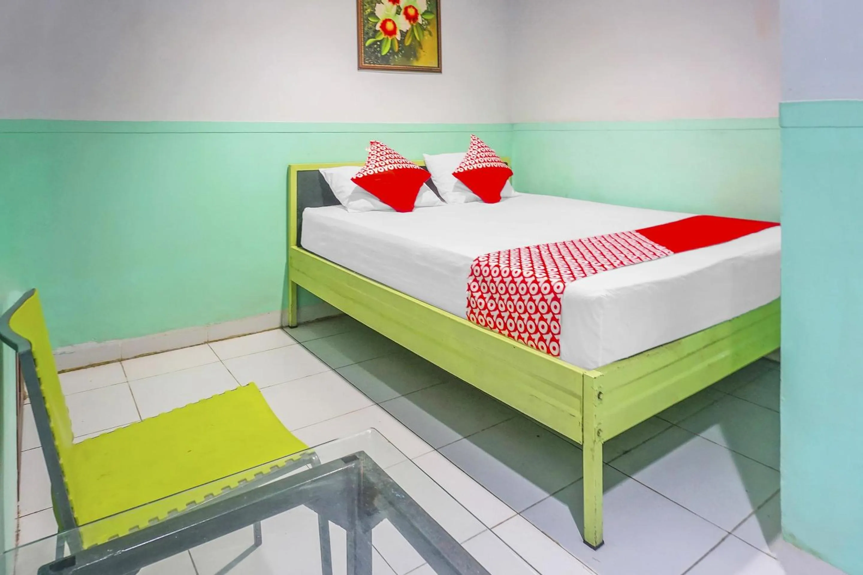 Bedroom in Hotel O Wisma Favorite Makassar Near Benteng Rotterdam