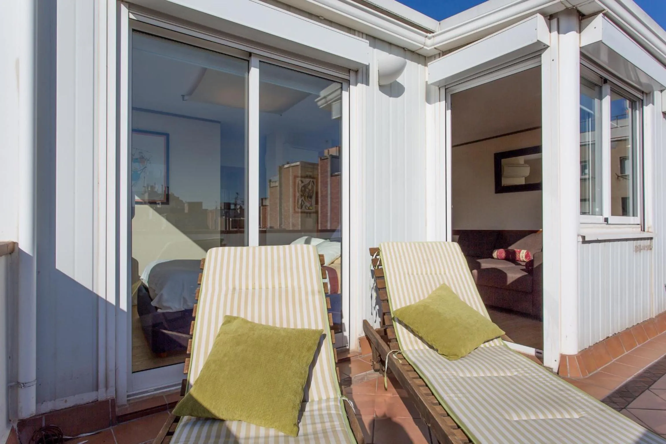 Day in Gaudi penthouse with terrace views