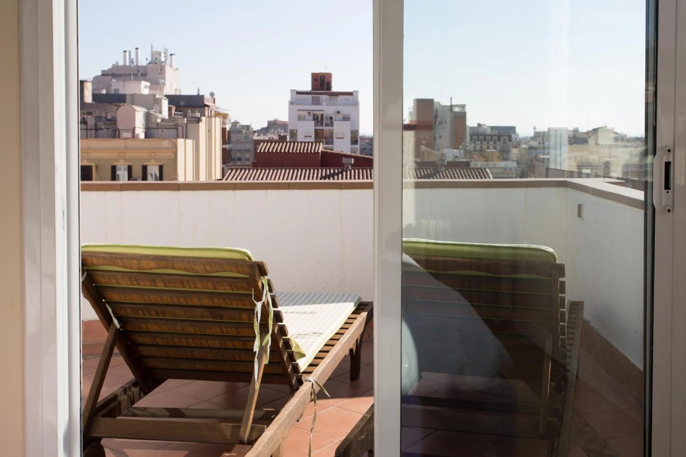 Day in Gaudi penthouse with terrace views