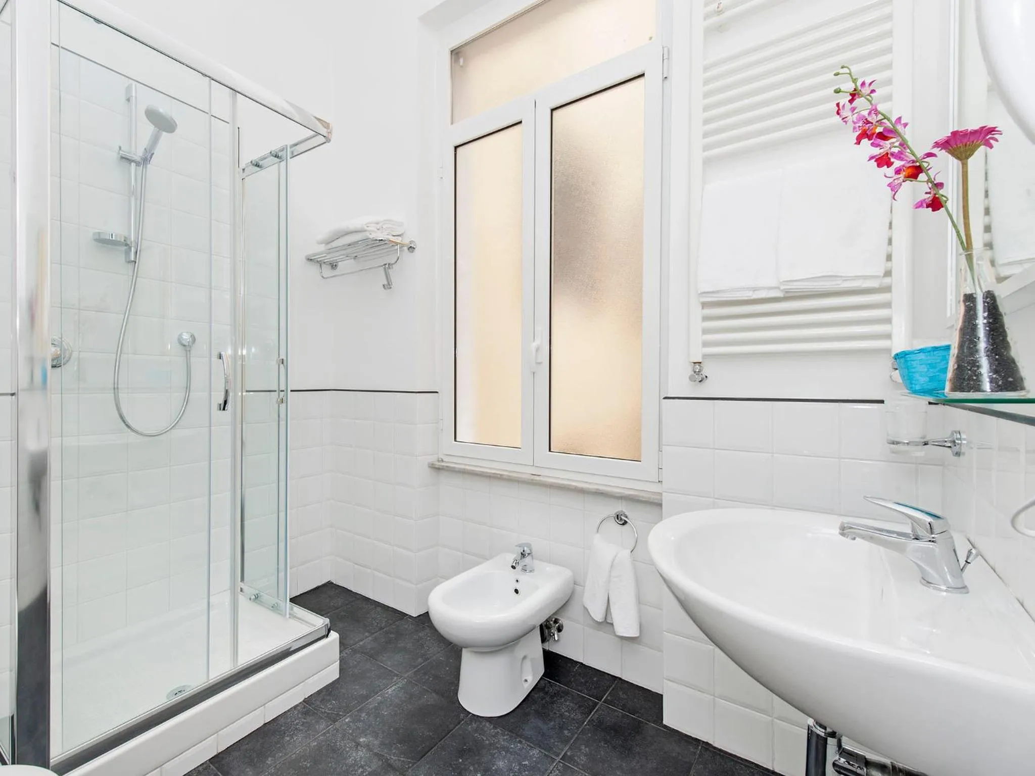 Bathroom in White Rooms Colosseo