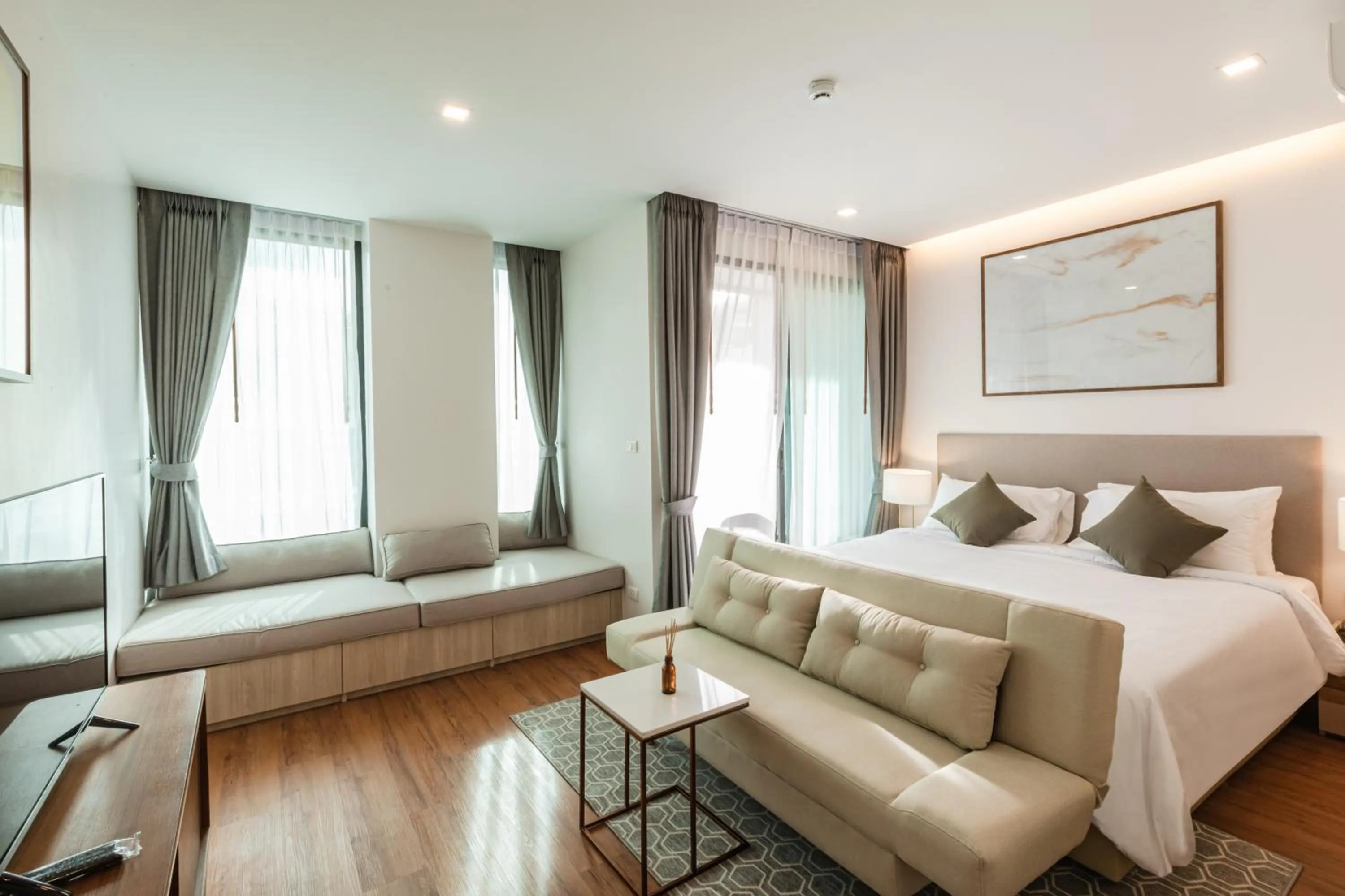 Living room, Bed in The Proud Rawai Resort