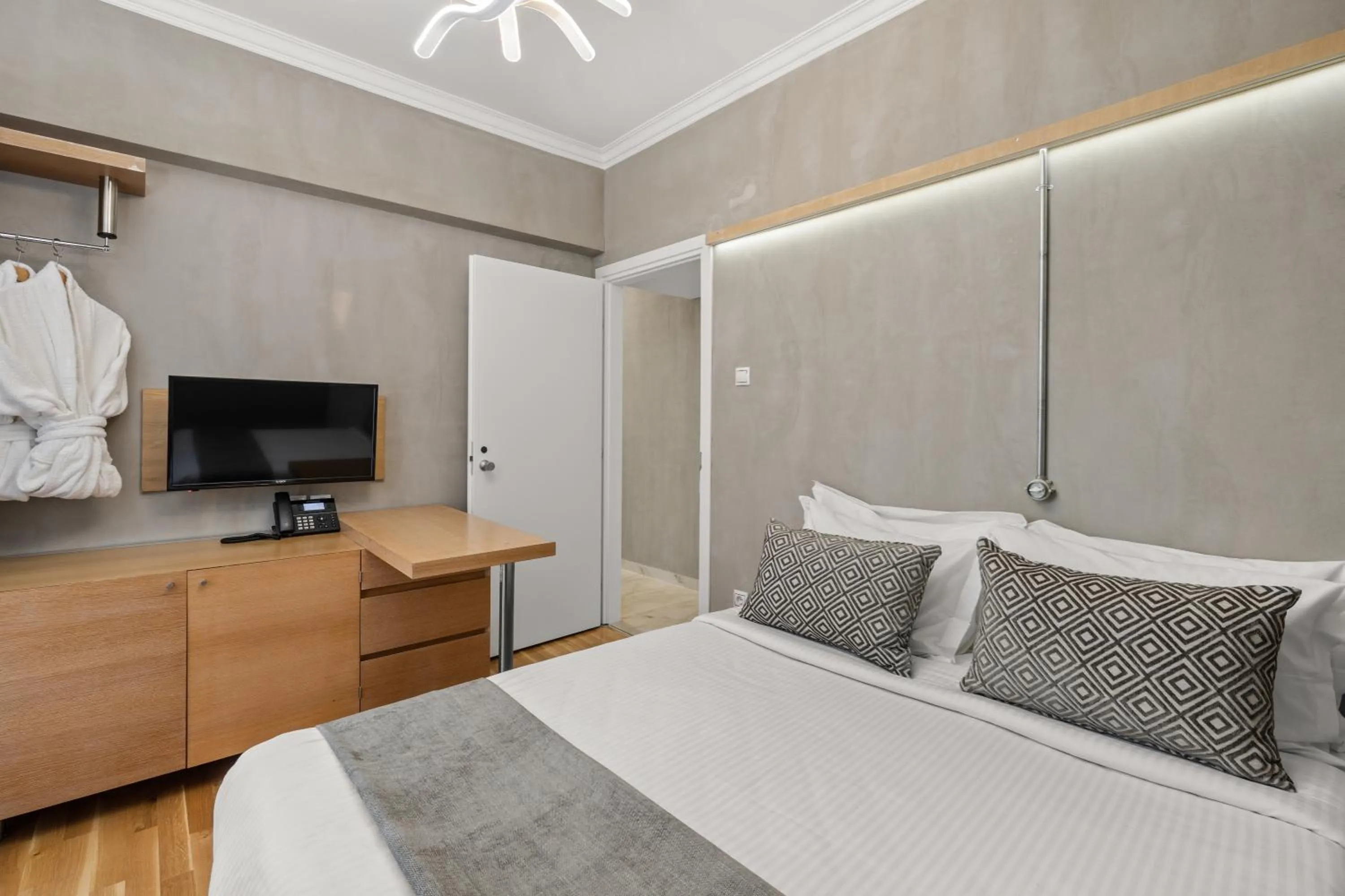 Communal lounge/ TV room in Athens Warehouse Boutique Hotel & Suites