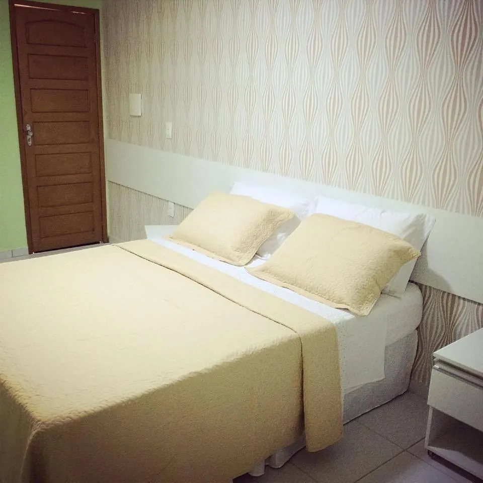 Bed in Pousada Ouriço