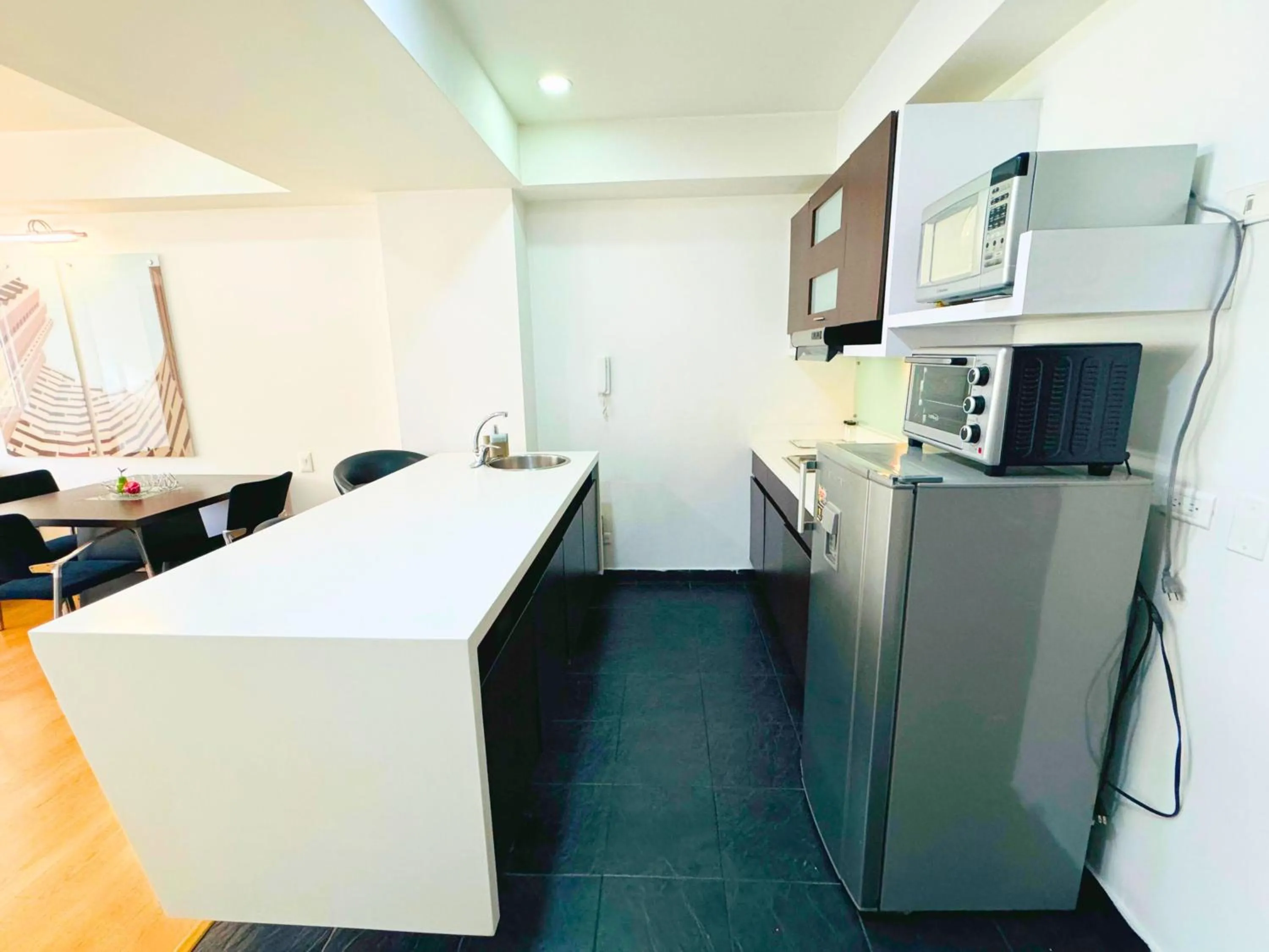 Kitchen or kitchenette in Aparta Suite Continental Bogotá