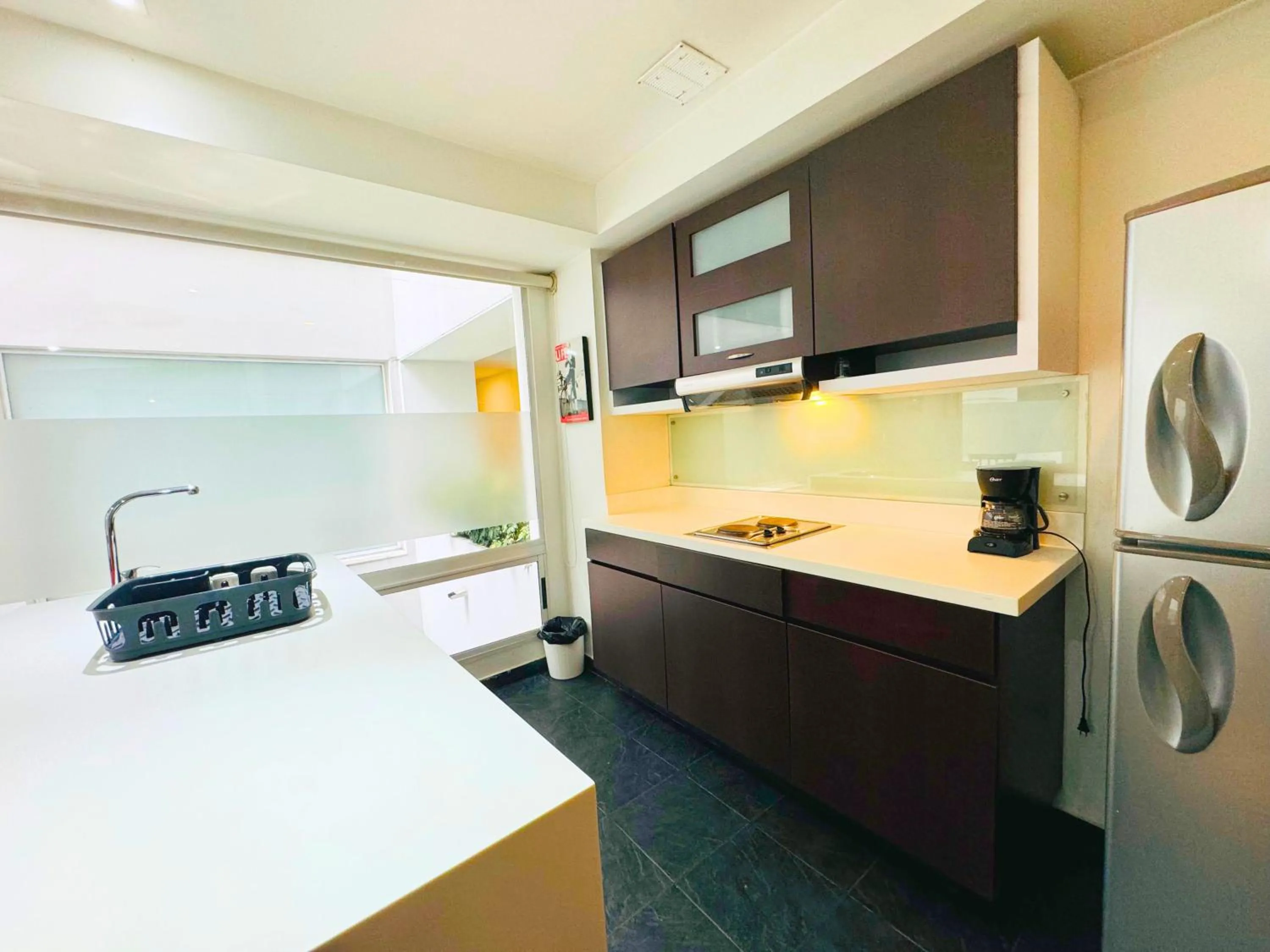 Kitchen or kitchenette in Aparta Suite Continental Bogotá