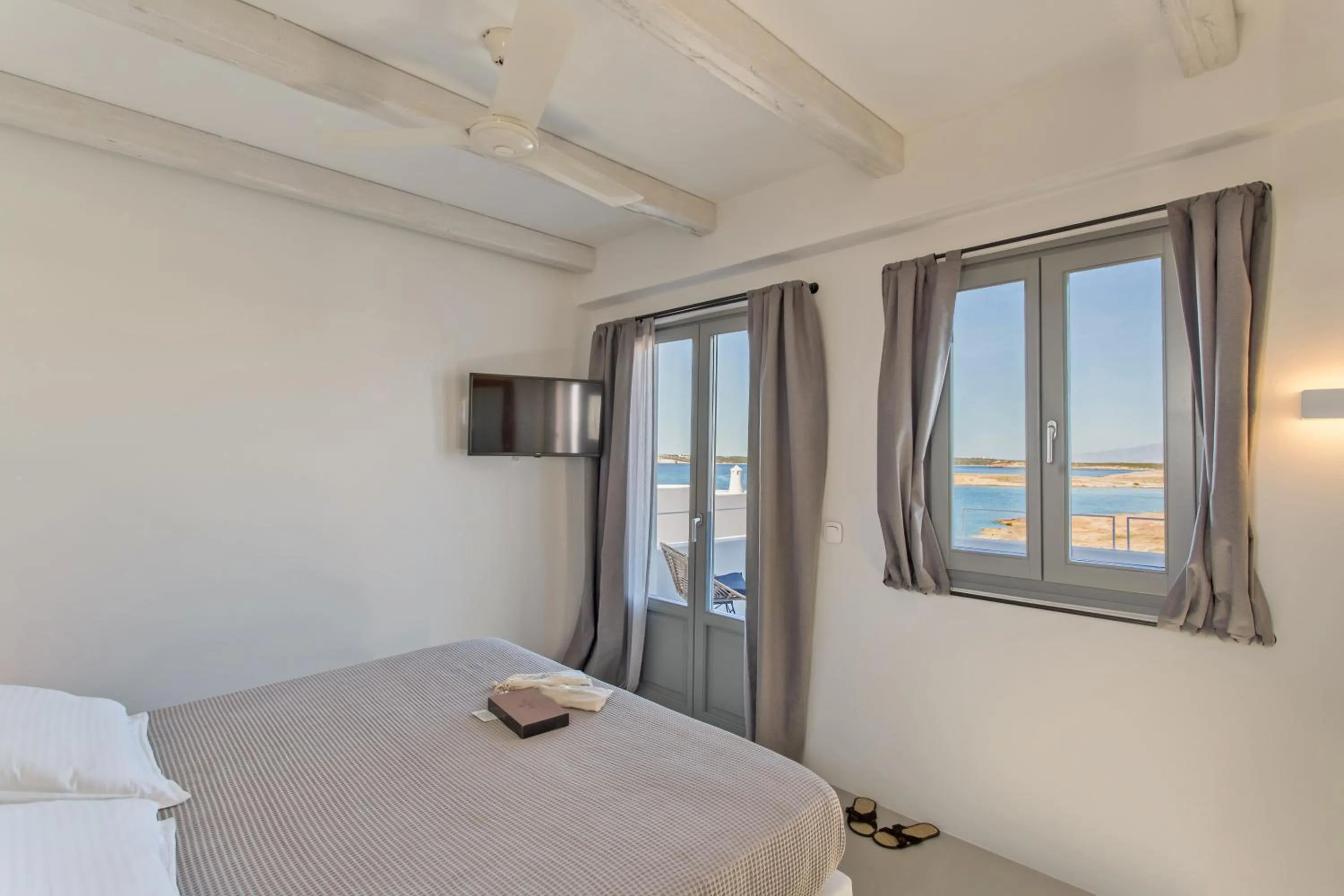 Bed in Paros Cape Suites