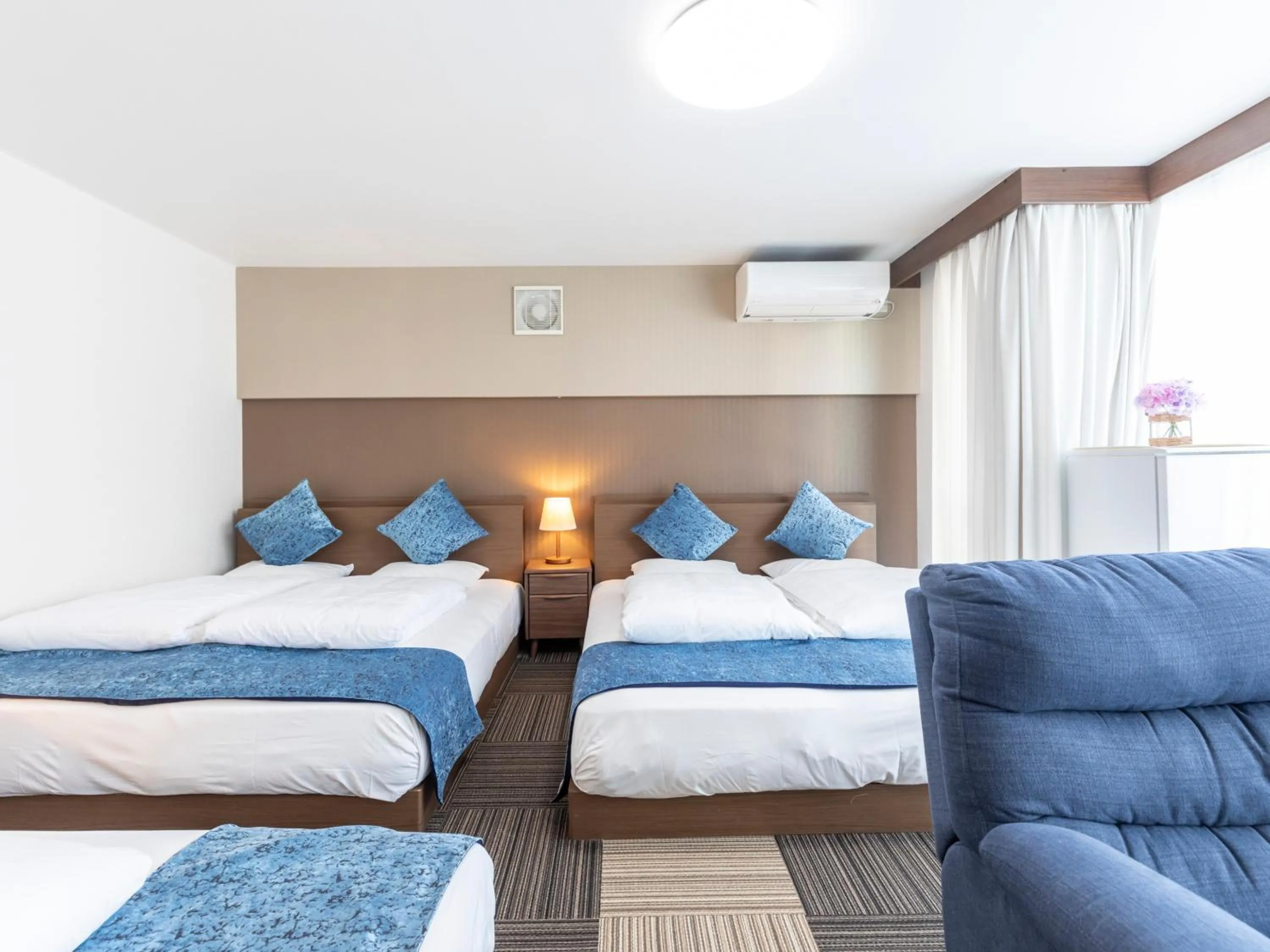 Bed in Tabist Sakuragawa River Side Hotel