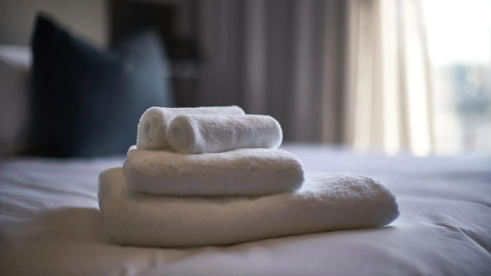 towels, Bed in The Catalyst Apartment Hotel by NEWMARK