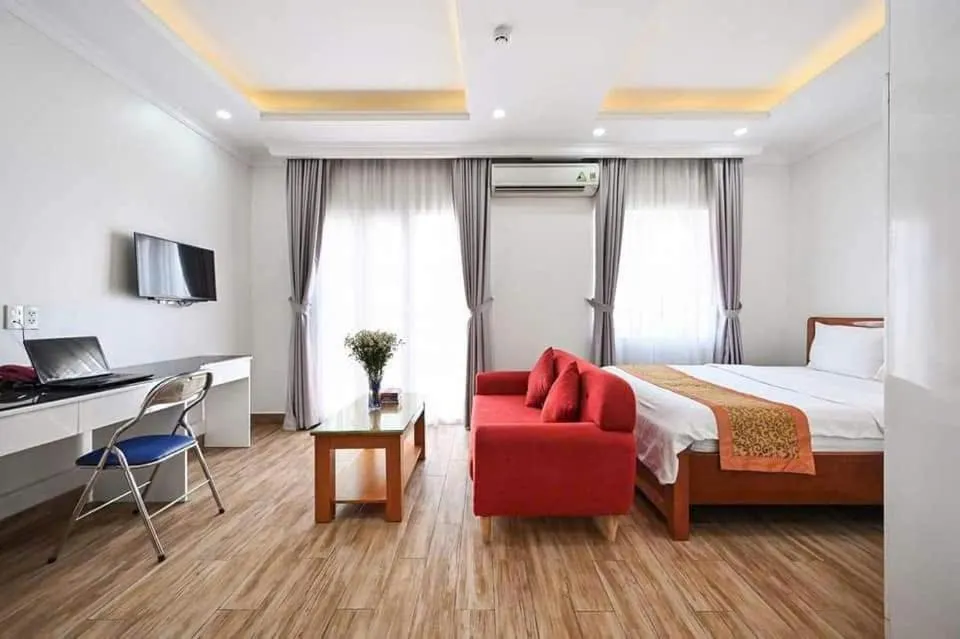 Bed in Genie Hotel & Serviced Apartments