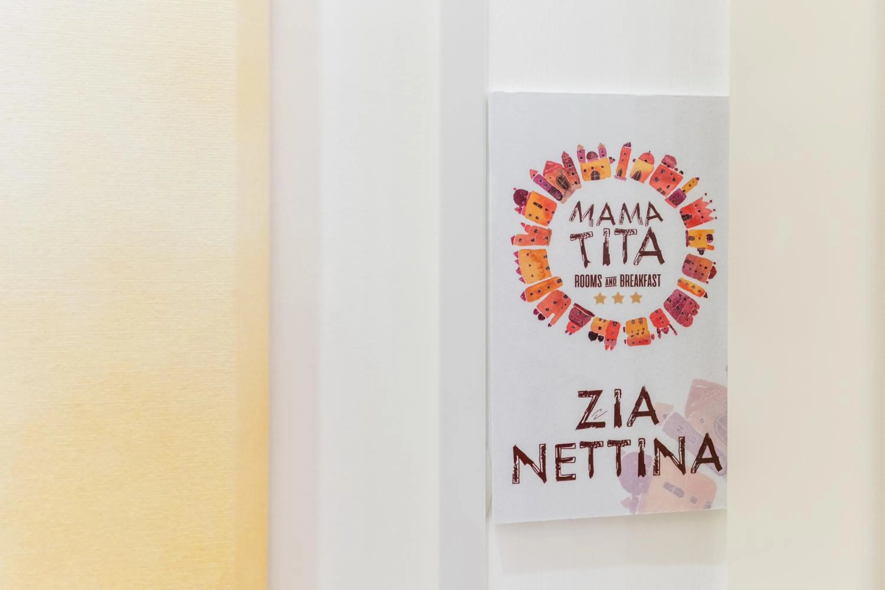 Property logo or sign in Mama Tita Rooms and Breakfast