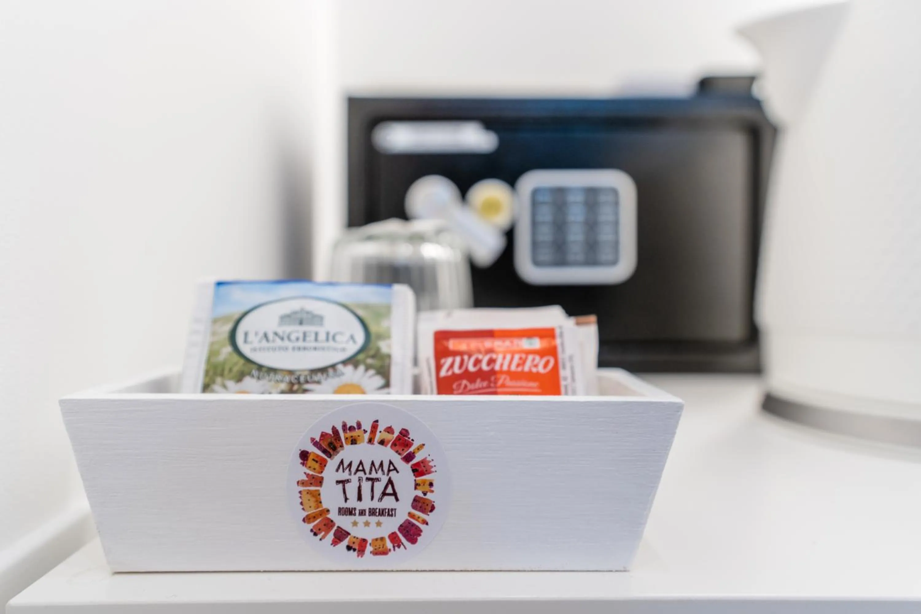 Property logo or sign in Mama Tita Rooms and Breakfast