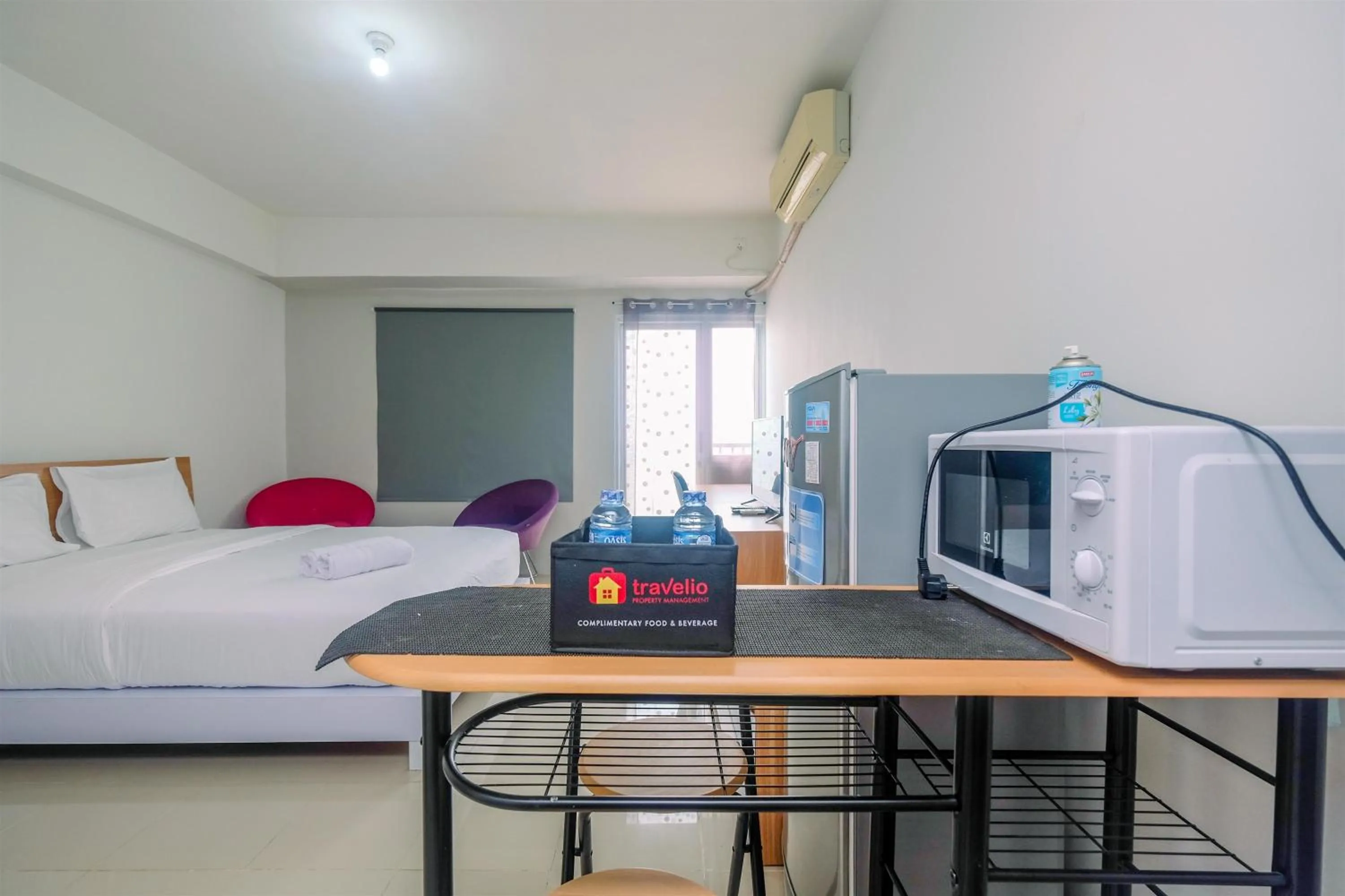 Bed in Chic and Cozy Studio Park View Condominium Apartment By Travelio