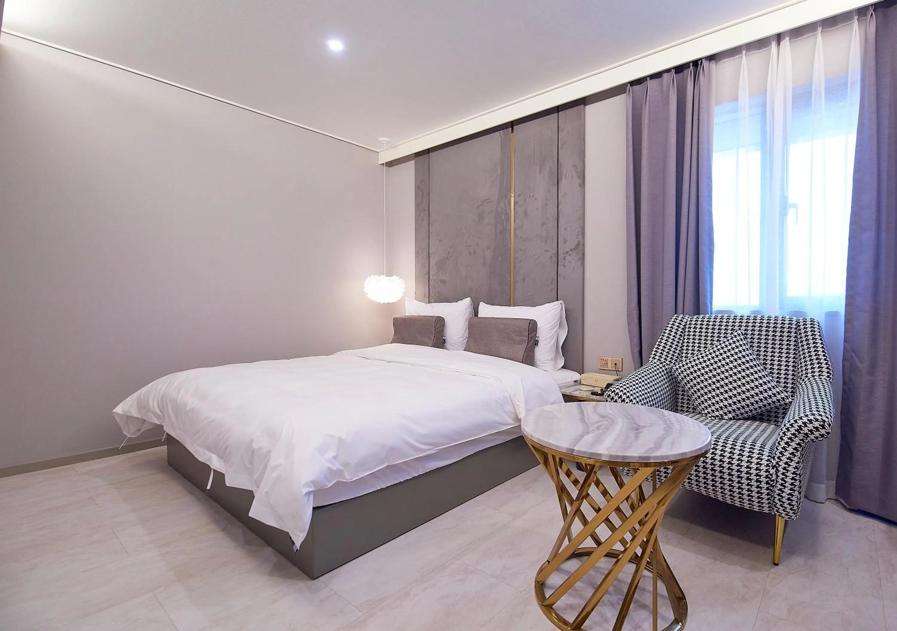 Bed in 사직 덴바스타 시그니처 호텔