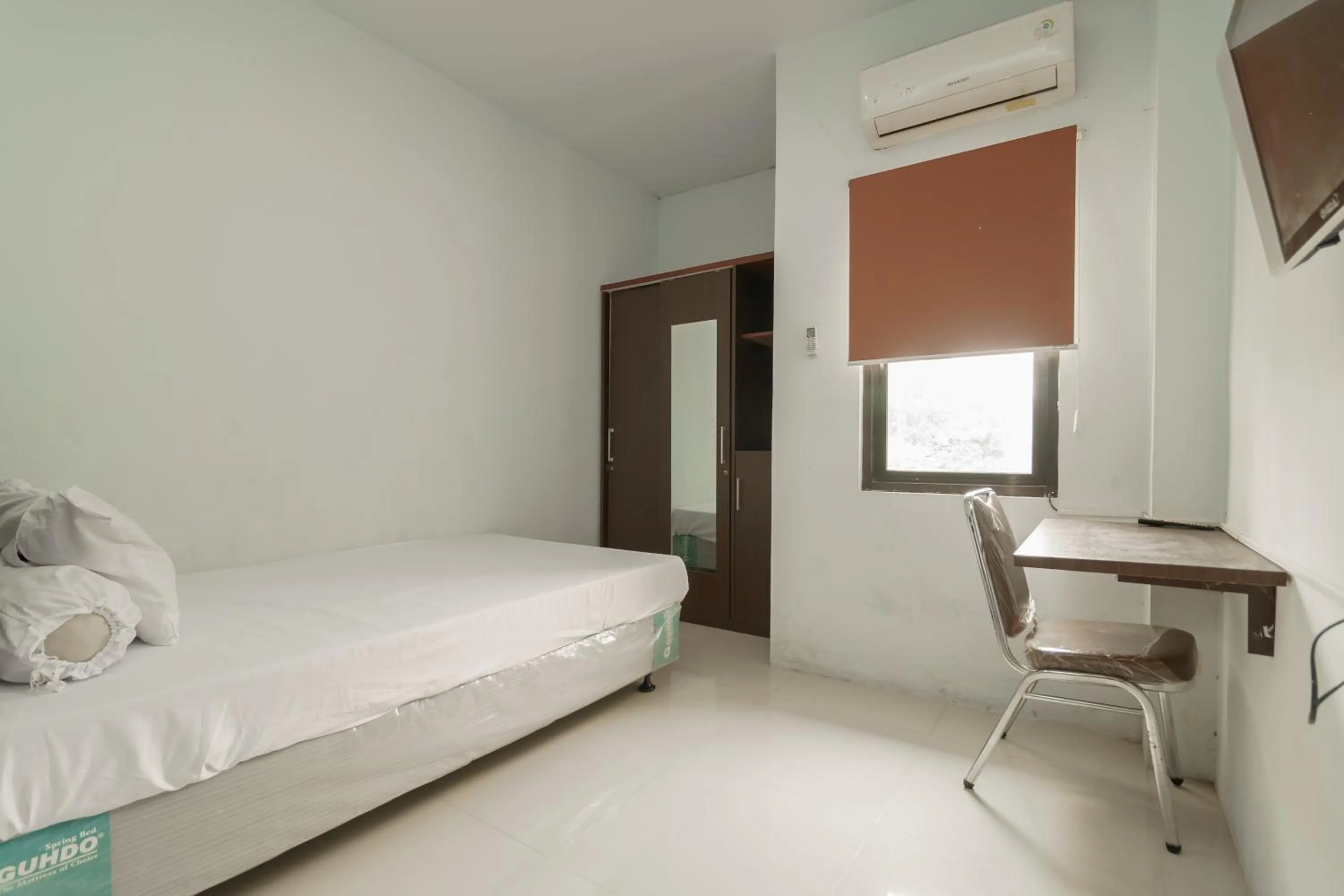 Bedroom in KoolKost Syariah near Kampus Utama Universitas Budi Luhur